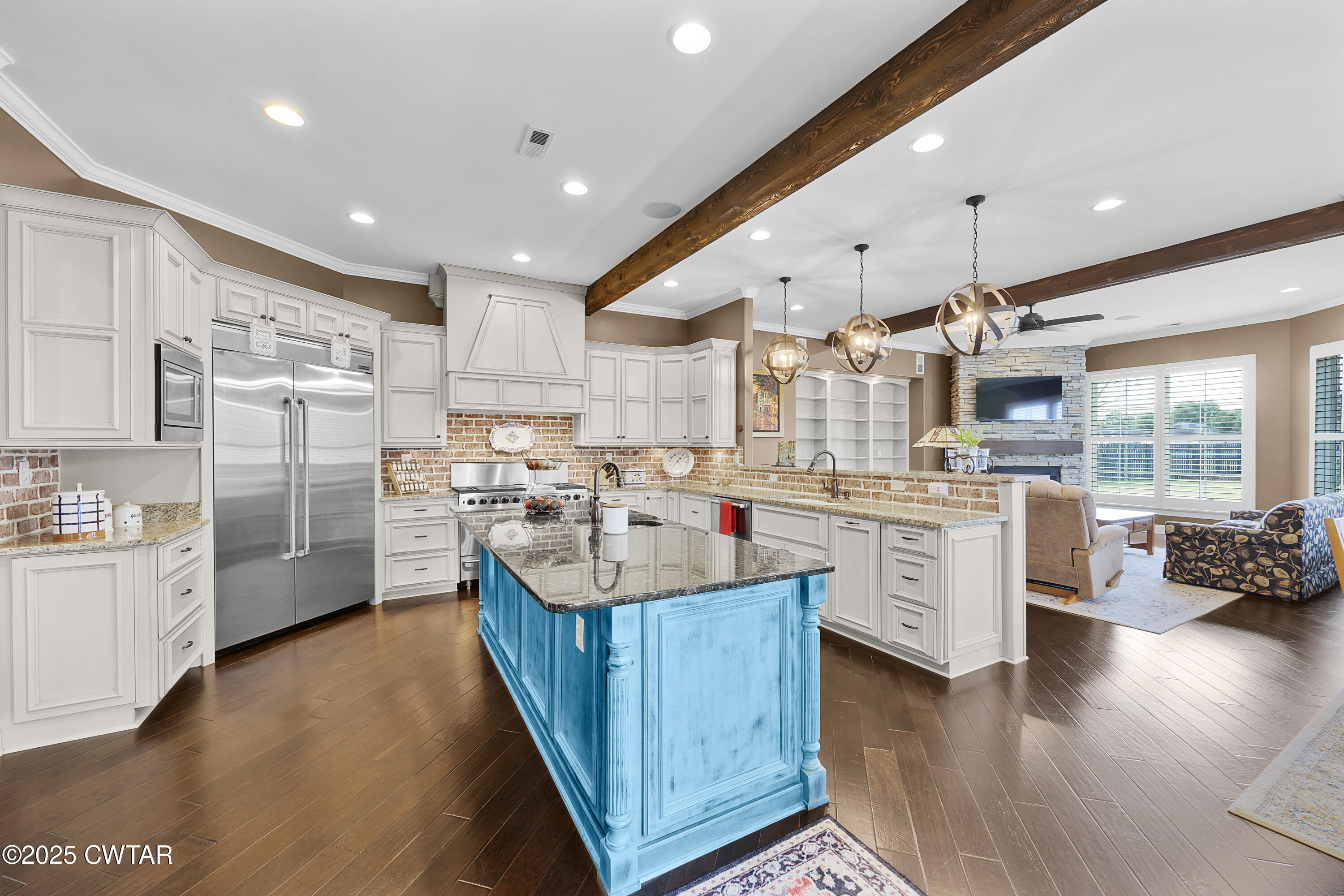 61 Rochester Cove Jackson, TN 38305 - Photo 19 of 55 a large kitchen with stainless steel appliances kitchen island granite countertop a large counter top stainless steel appliances and cabinets