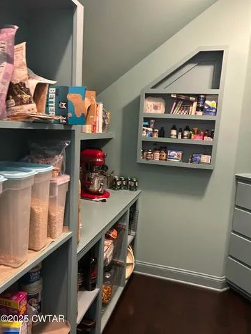 a bathroom with a mirror and a sink