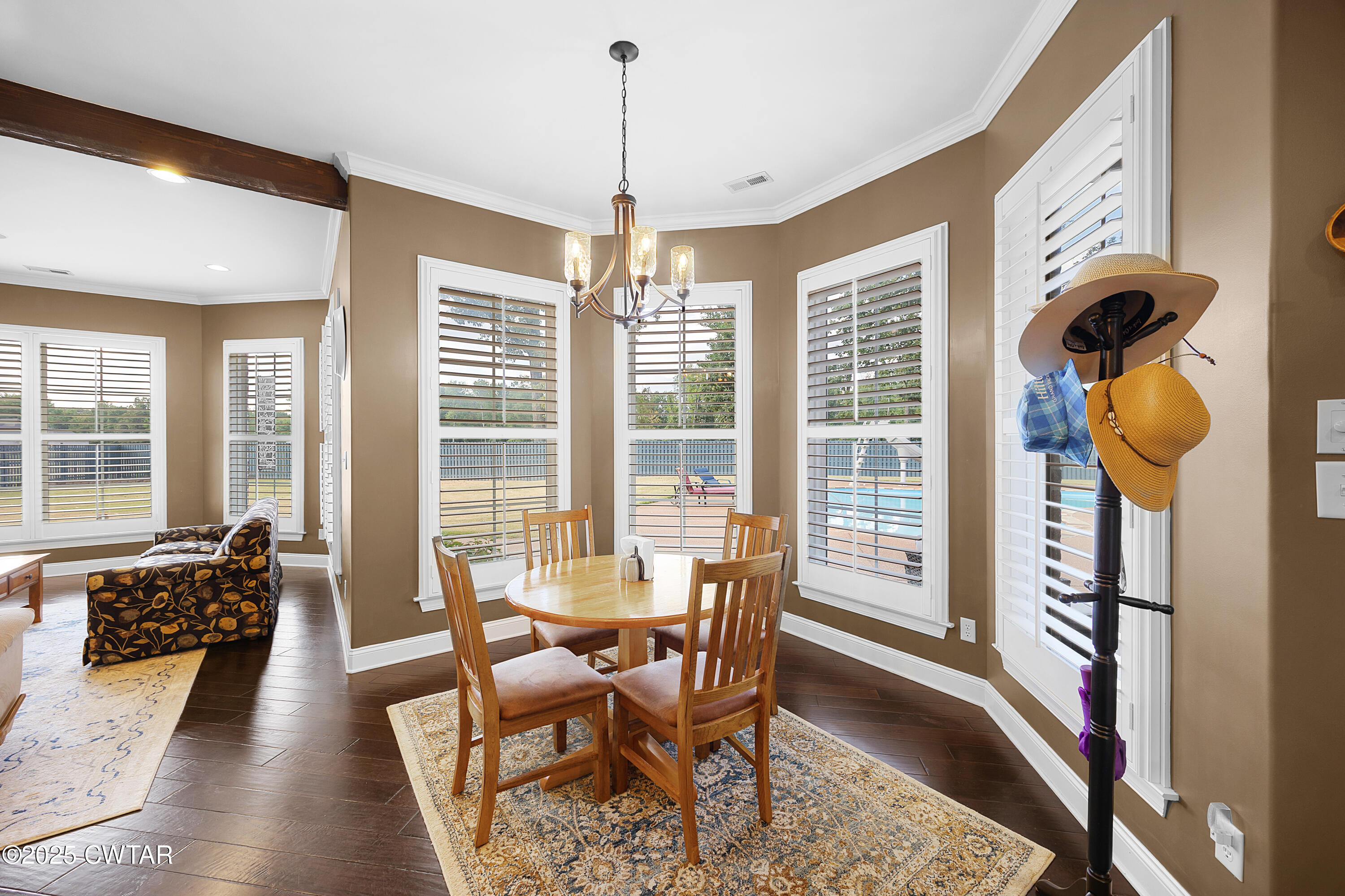 61 Rochester Cove Jackson, TN 38305 - Photo 24 of 55 a view of a dining room with furniture window and wooden floor