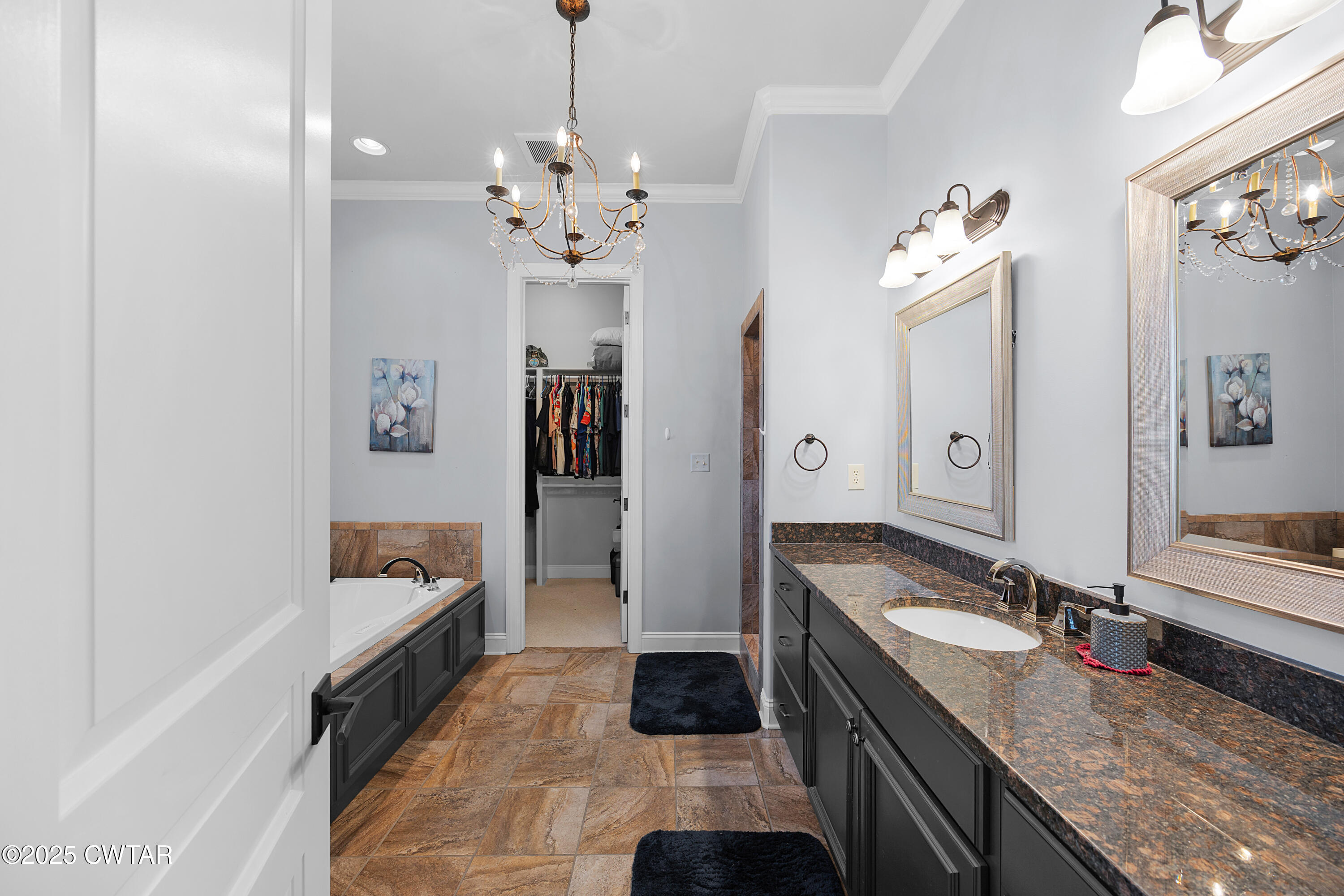 61 Rochester Cove Jackson, TN 38305 - Photo 38 of 55 a spacious bathroom with a granite countertop sink a mirror and shower