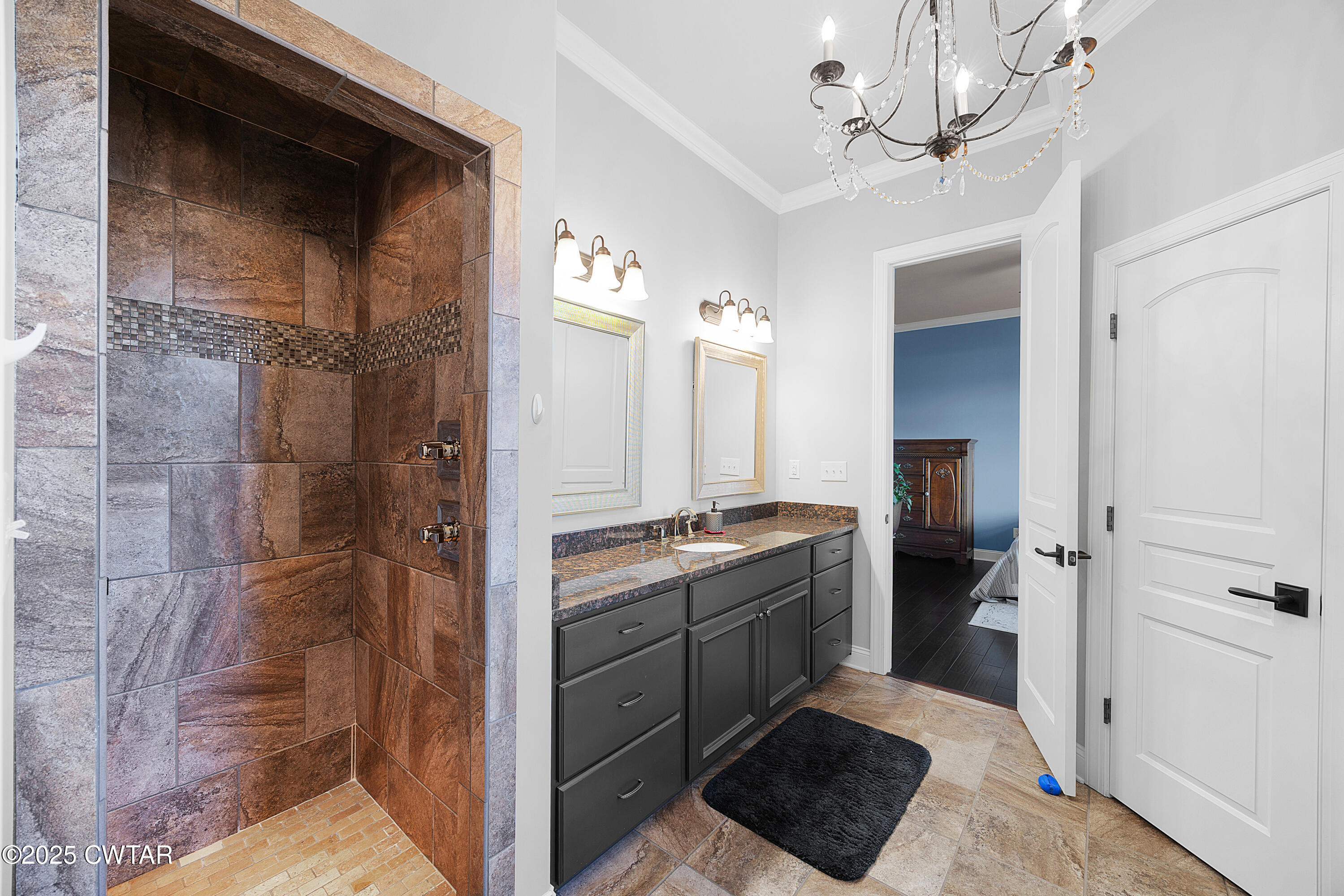 61 Rochester Cove Jackson, TN 38305 - Photo 39 of 55 a bathroom with a granite countertop sink a mirror and shower