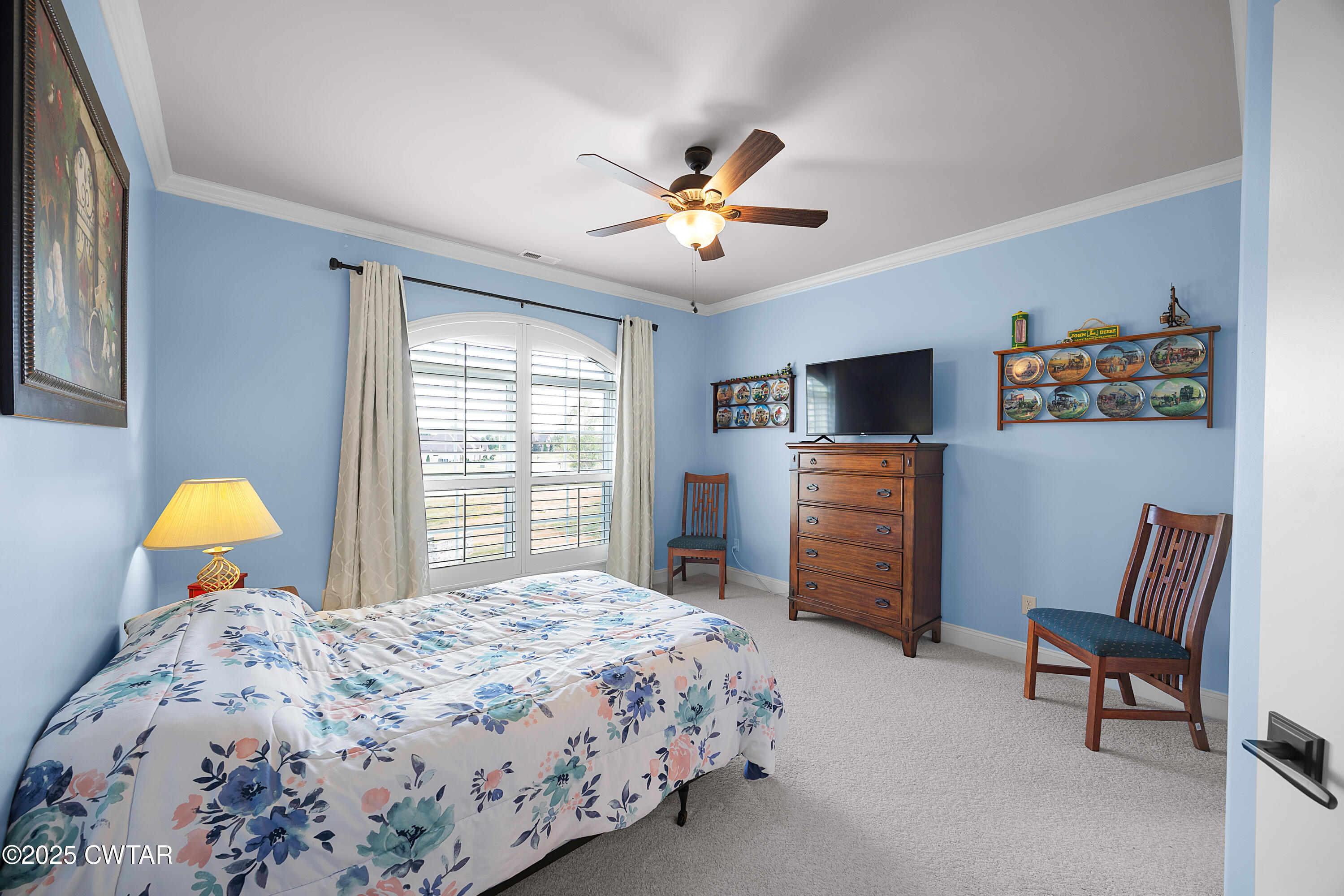 61 Rochester Cove Jackson, TN 38305 - Photo 46 of 55 a bedroom with a bed and a chandelier