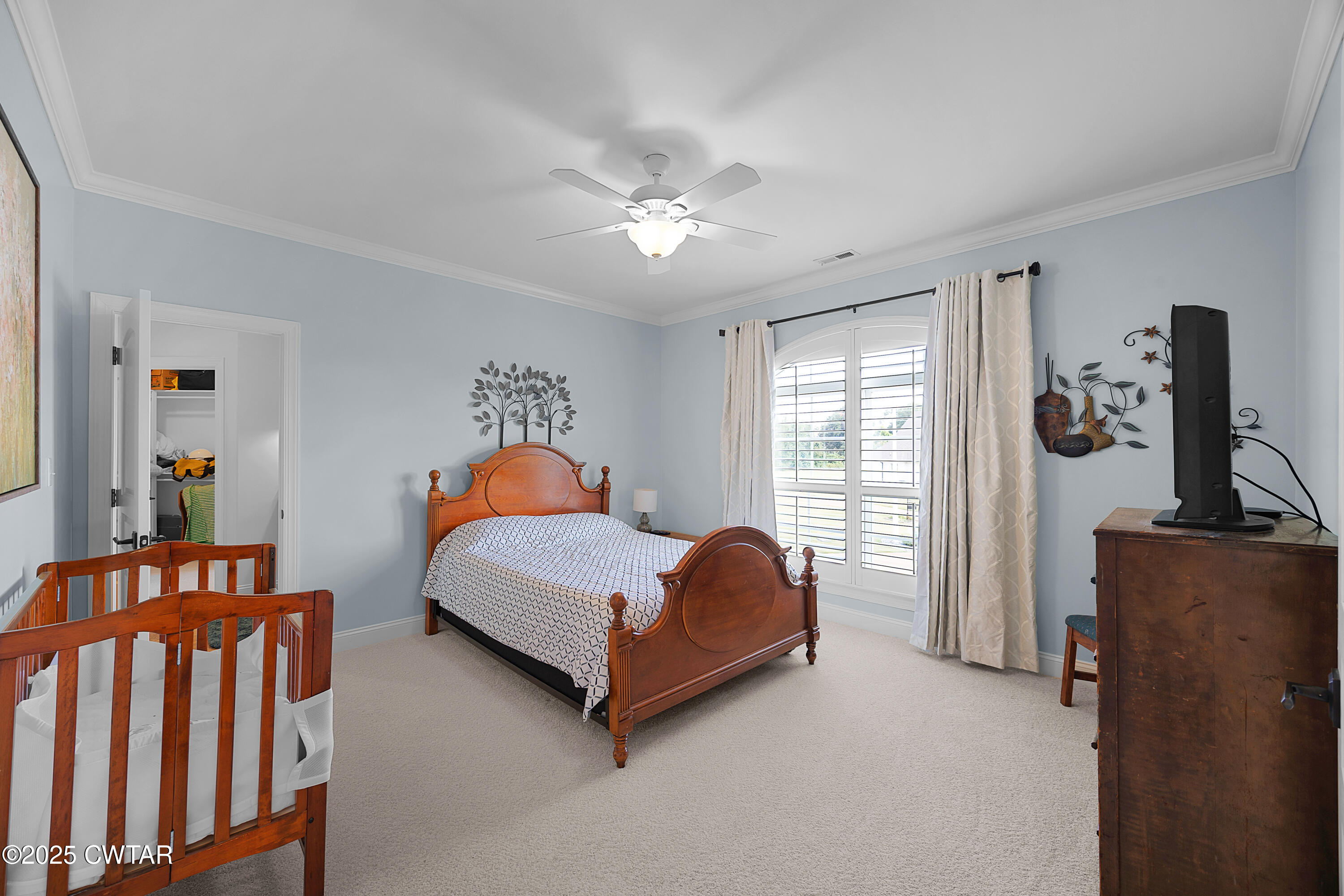 61 Rochester Cove Jackson, TN 38305 - Photo 48 of 55 a bedroom with a bed and a chandelier