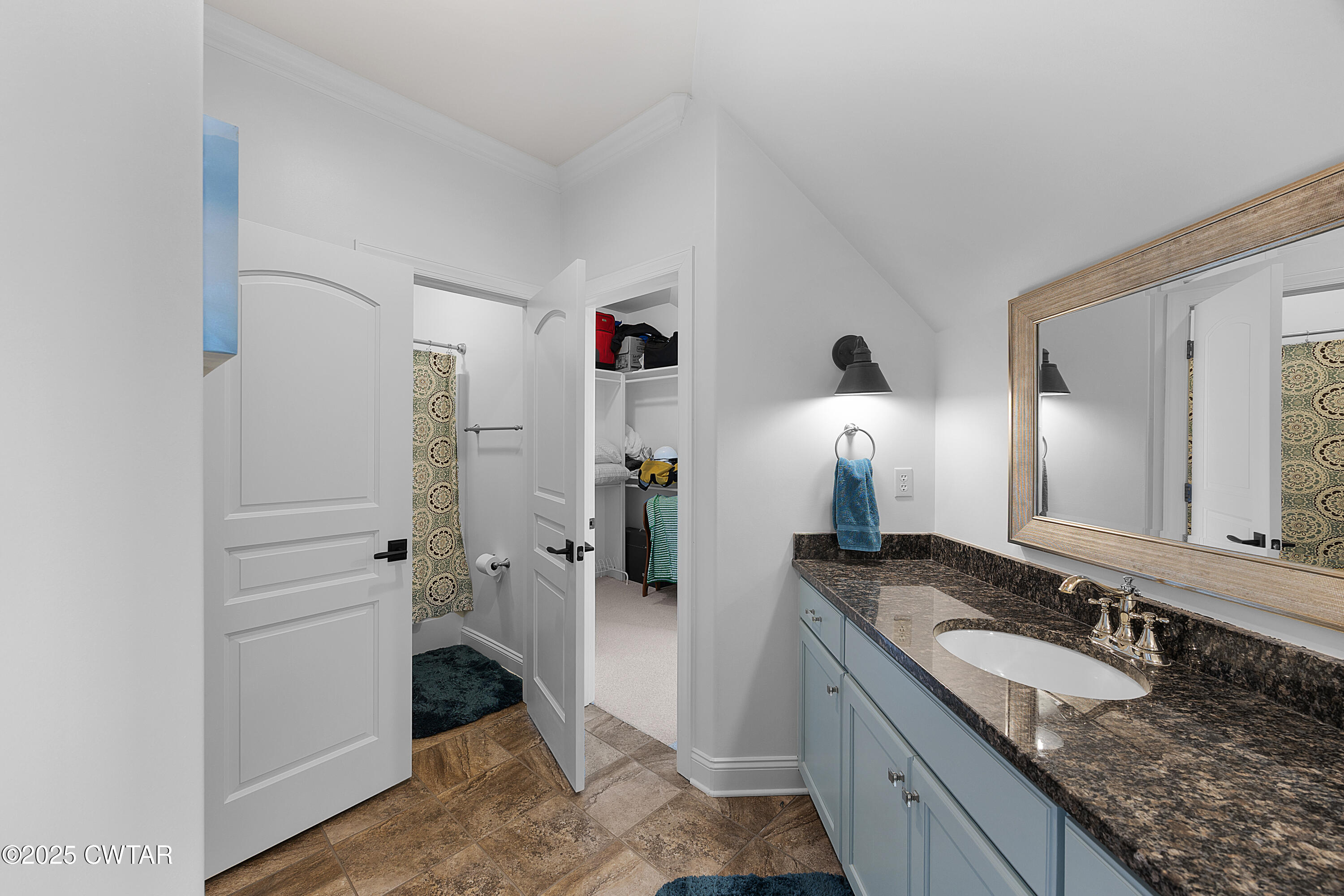 61 Rochester Cove Jackson, TN 38305 - Photo 50 of 55 a bathroom with a granite countertop sink and a mirror