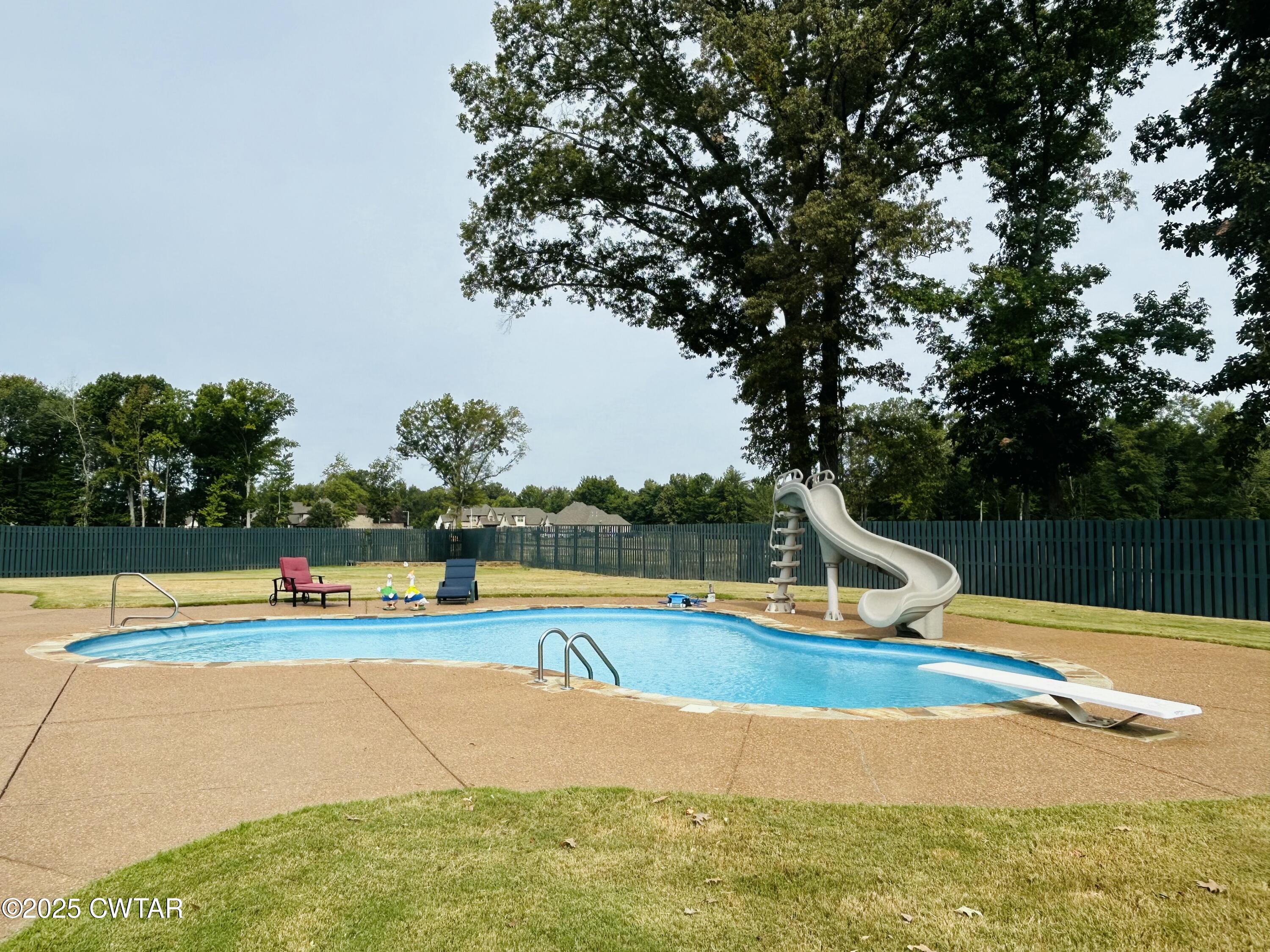 61 Rochester Cove Jackson, TN 38305 - Photo 9 of 55 a view of a swimming pool with a lounge chair