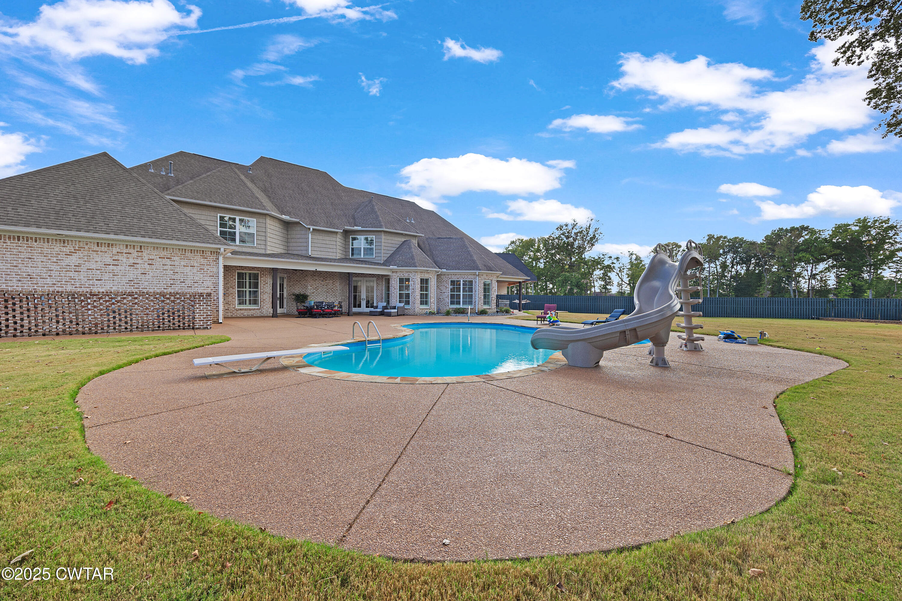 61 Rochester Cove Jackson, TN 38305 - Photo 10 of 55 a view of a house with swimming pool and a yard