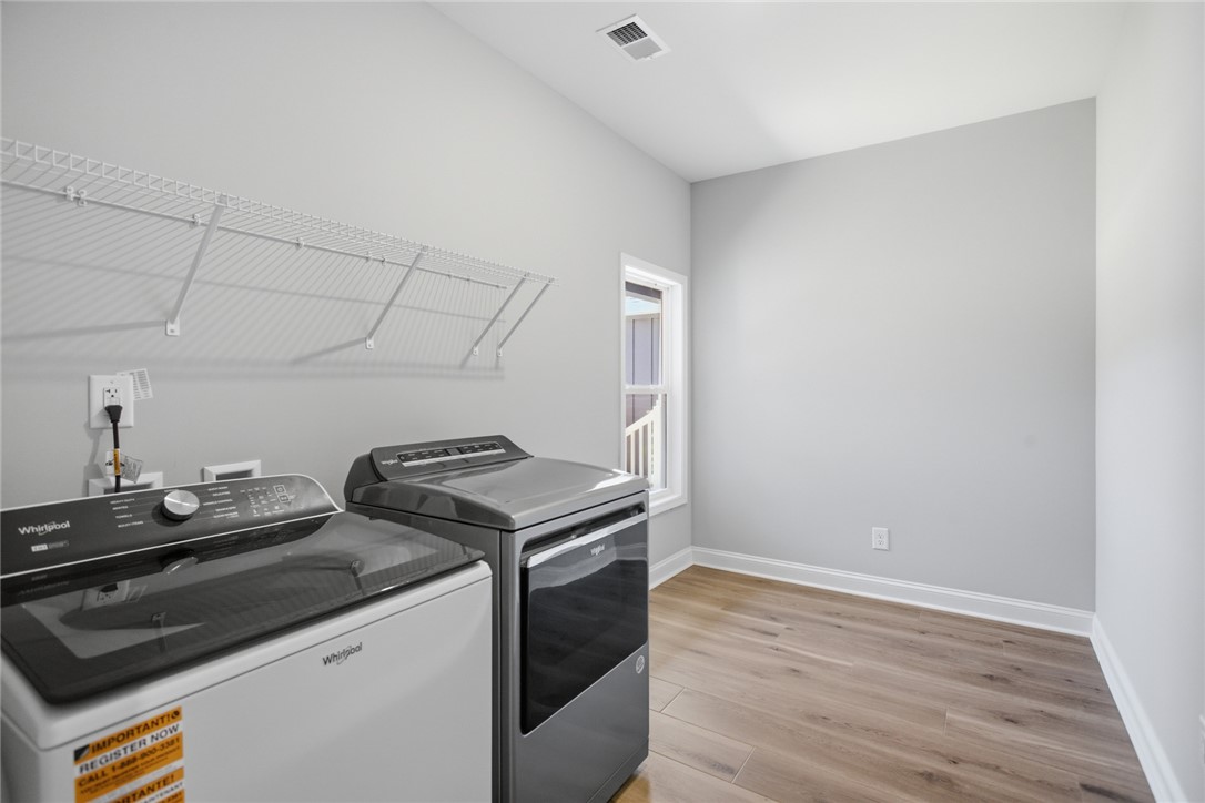 912 Watercrest Road West Union, SC 29696 - Photo 29 of 49 This spacious laundry area offers practical convenience with durable flooring and ample storage.