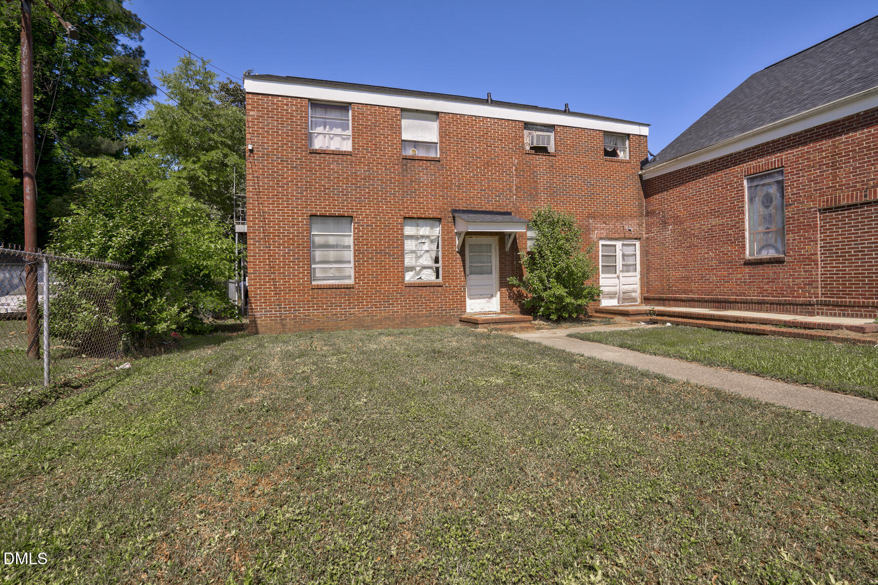 408 Cokey Road Rocky Mount, NC 27801 - Photo 15 of 46 a front view of a house with a yard