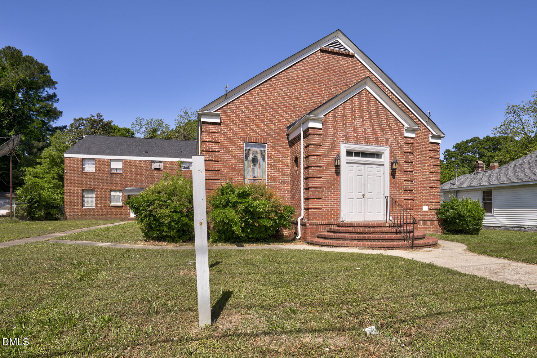408 Cokey Road Rocky Mount, NC 27801 - Photo 17 of 46 a front view of a house with a yard