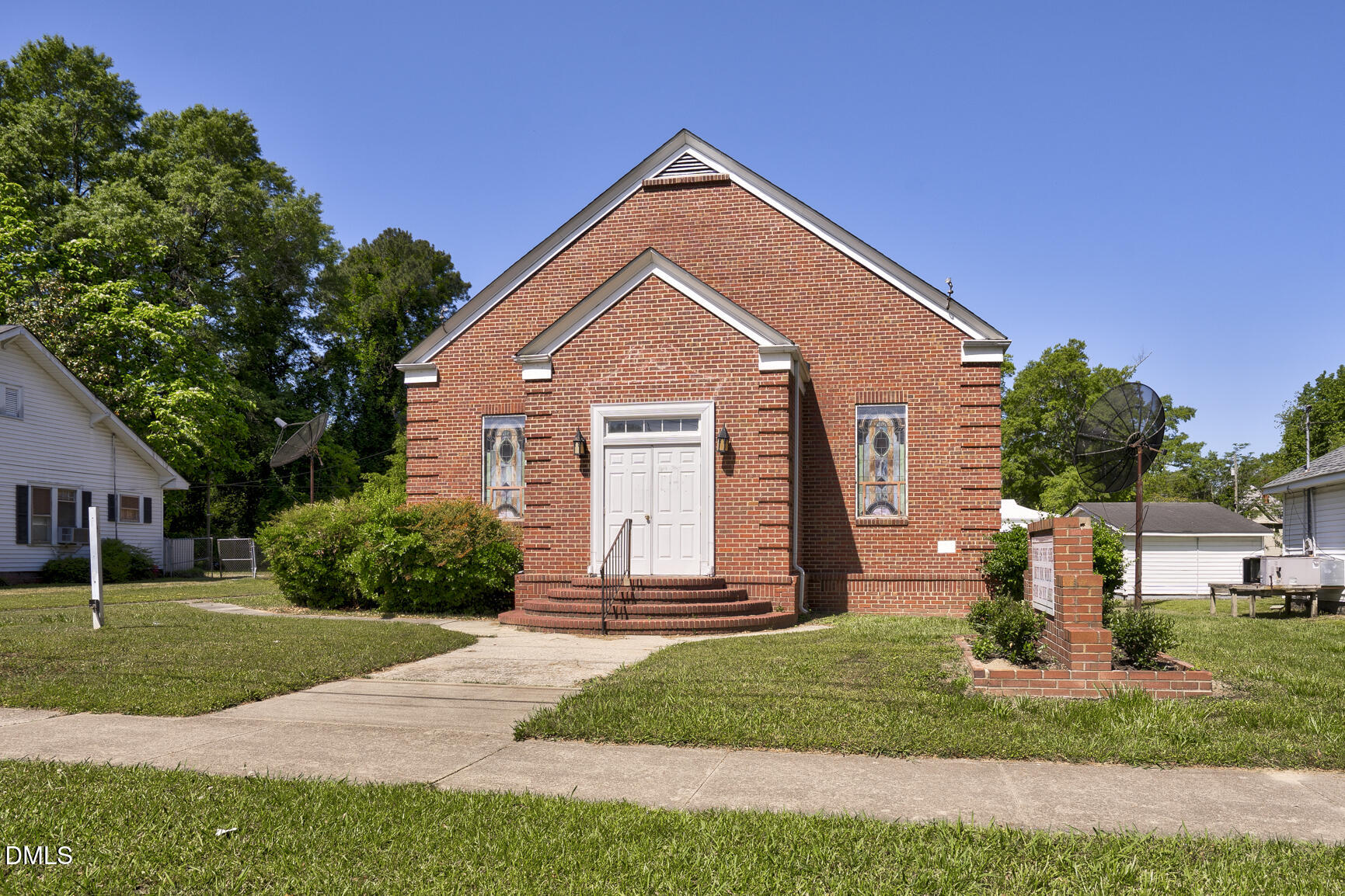 408 Cokey Road Rocky Mount, NC 27801 - Photo 18 of 46 a front view of a house with a yard
