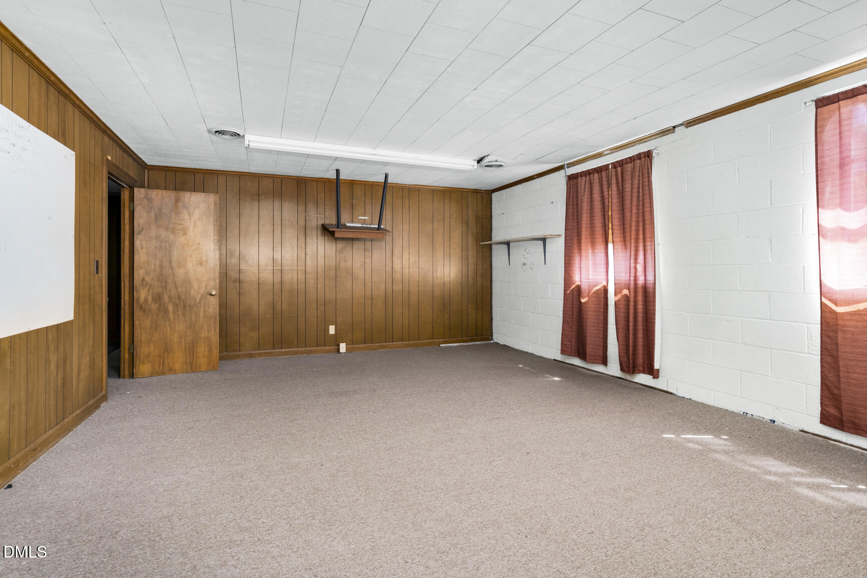 408 Cokey Road Rocky Mount, NC 27801 - Photo 36 of 46 an empty room with windows and closet