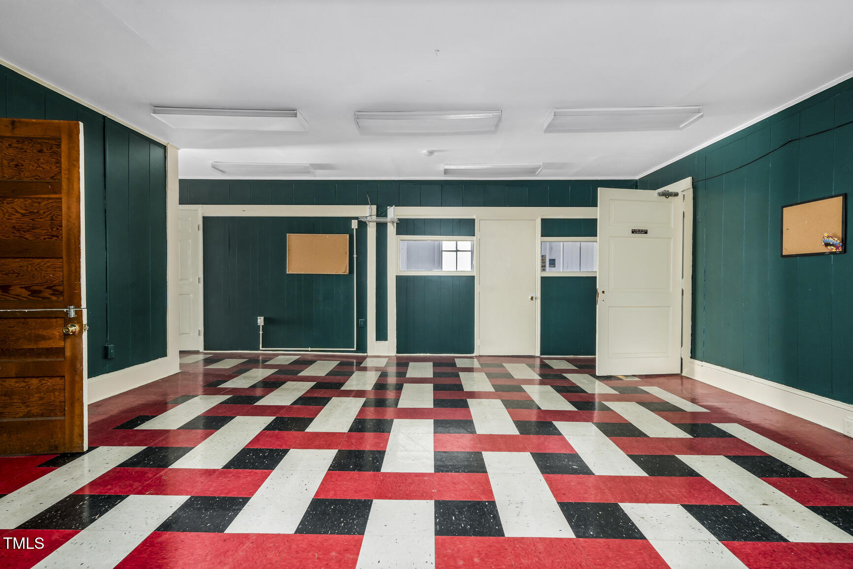 408 Cokey Road Rocky Mount, NC 27801 - Photo 6 of 46 a view of a living room with a black and white checkered floor