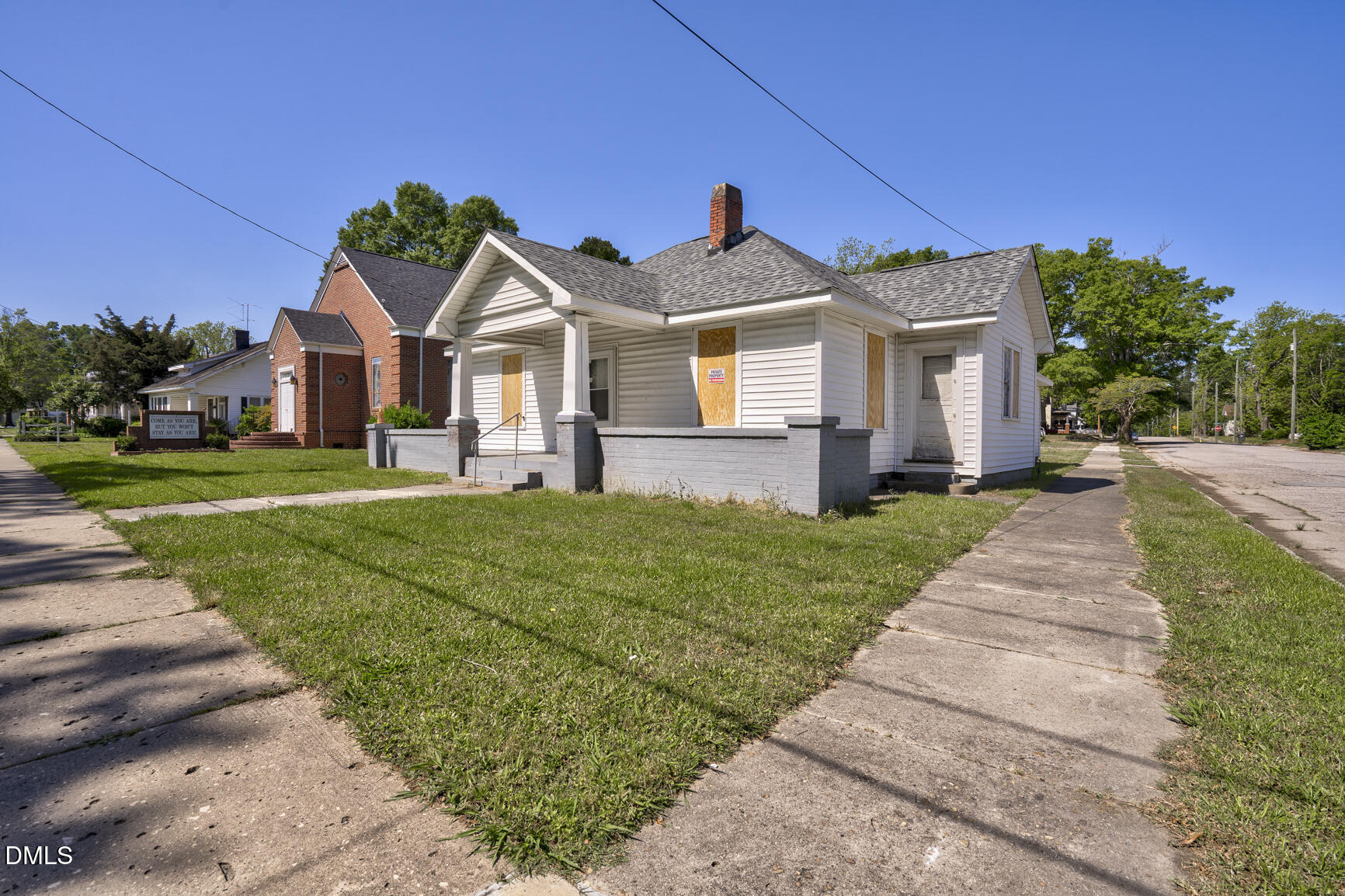 408 Cokey Road Rocky Mount, NC 27801 - Photo 7 of 46 a front view of a house with a yard