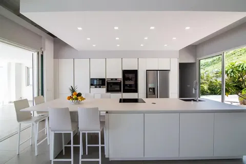 a very nice looking dining room with wooden floor and windows