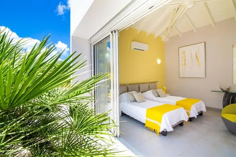 a bedroom with bed and a window