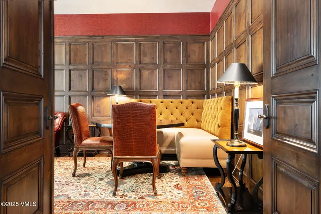 a dining room with furniture and a window