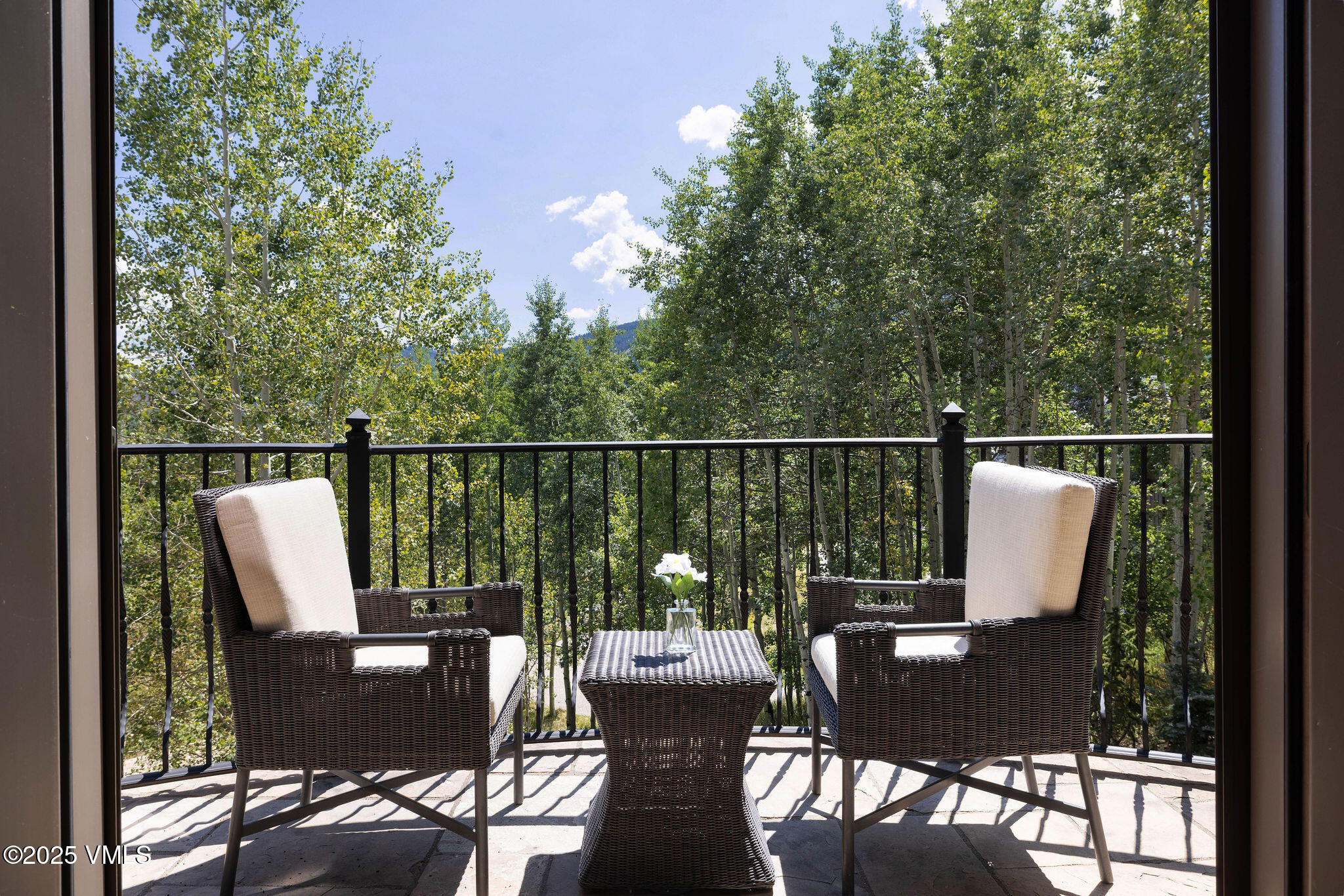 463 Borders Road Beaver Creek, CO 81620 - Photo 19 of 43 a view of a deck with two chair and wooden floor