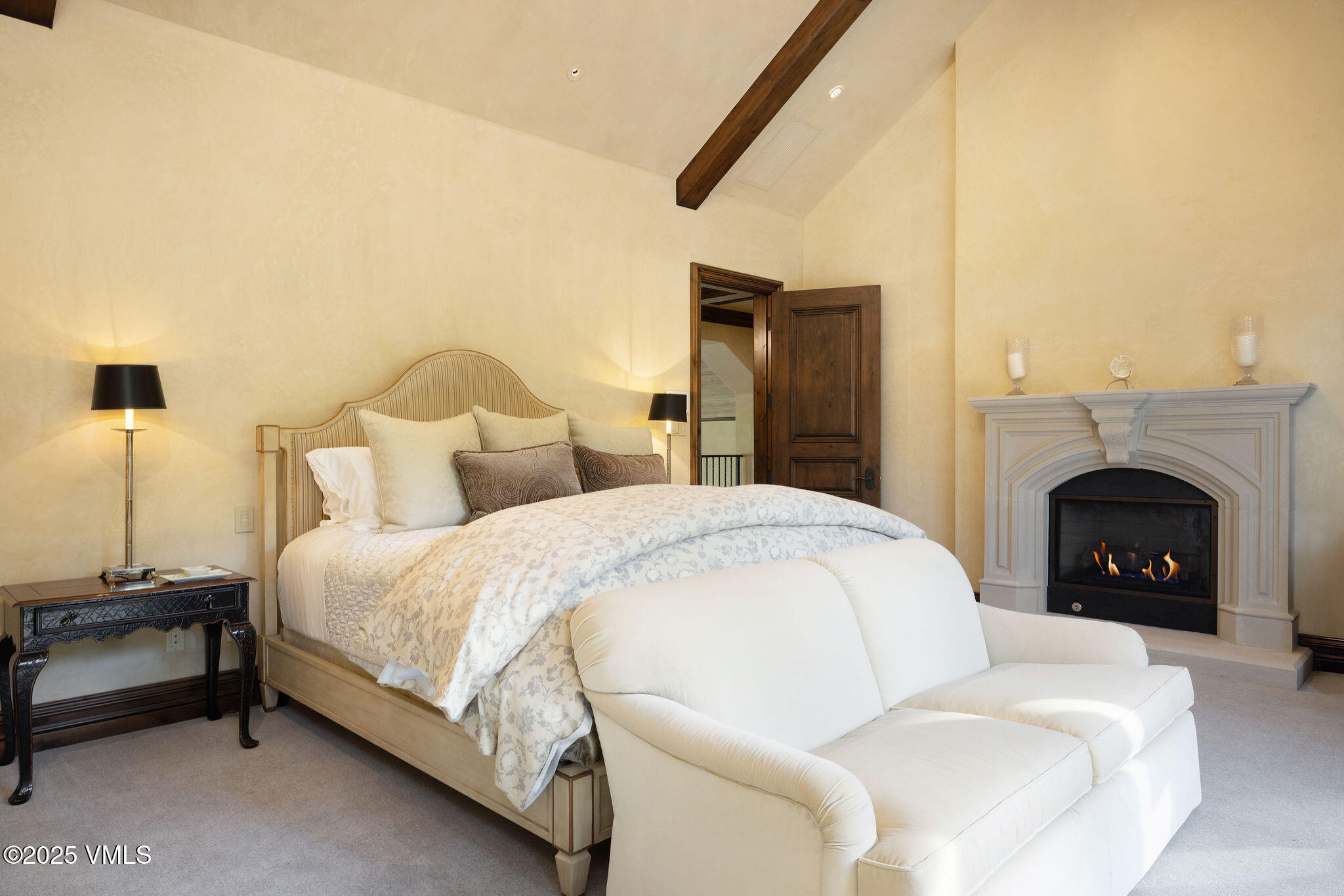 463 Borders Road Beaver Creek, CO 81620 - Photo 25 of 43 a spacious bedroom with a bed and a fireplace