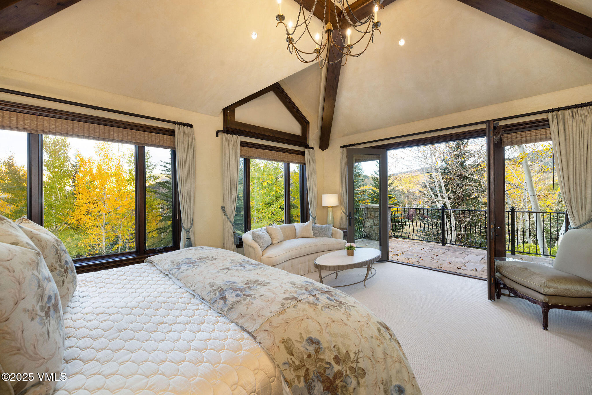 463 Borders Road Beaver Creek, CO 81620 - Photo 29 of 43 a bedroom with a bed and large windows