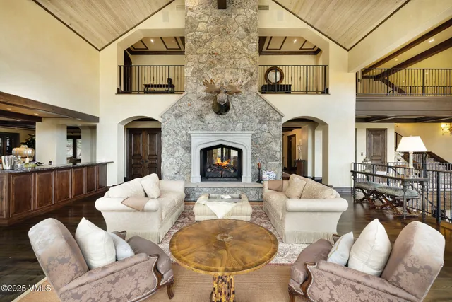 a living room with furniture fireplace and a fireplace
