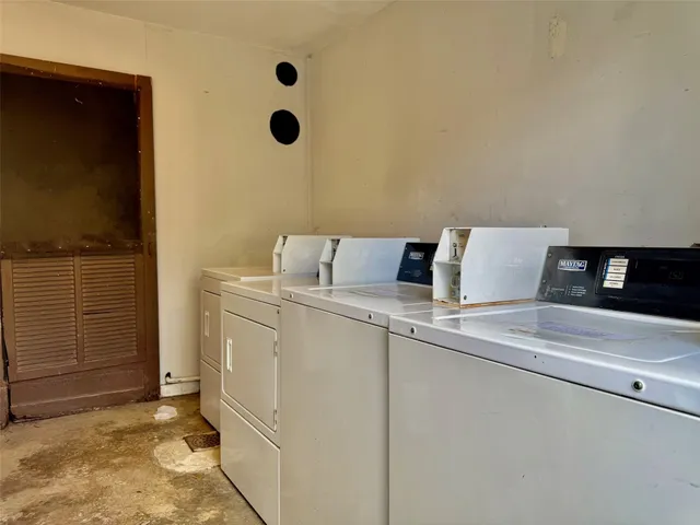 a view of a backyard with wooden fence
