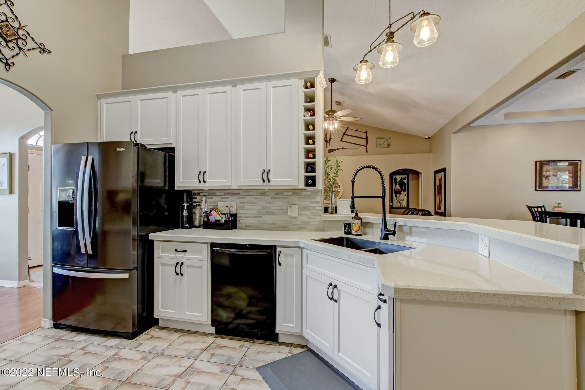 54025 Paddock Court Callahan, FL 32011 - Photo 15 of 47 a kitchen with a sink appliances and cabinets