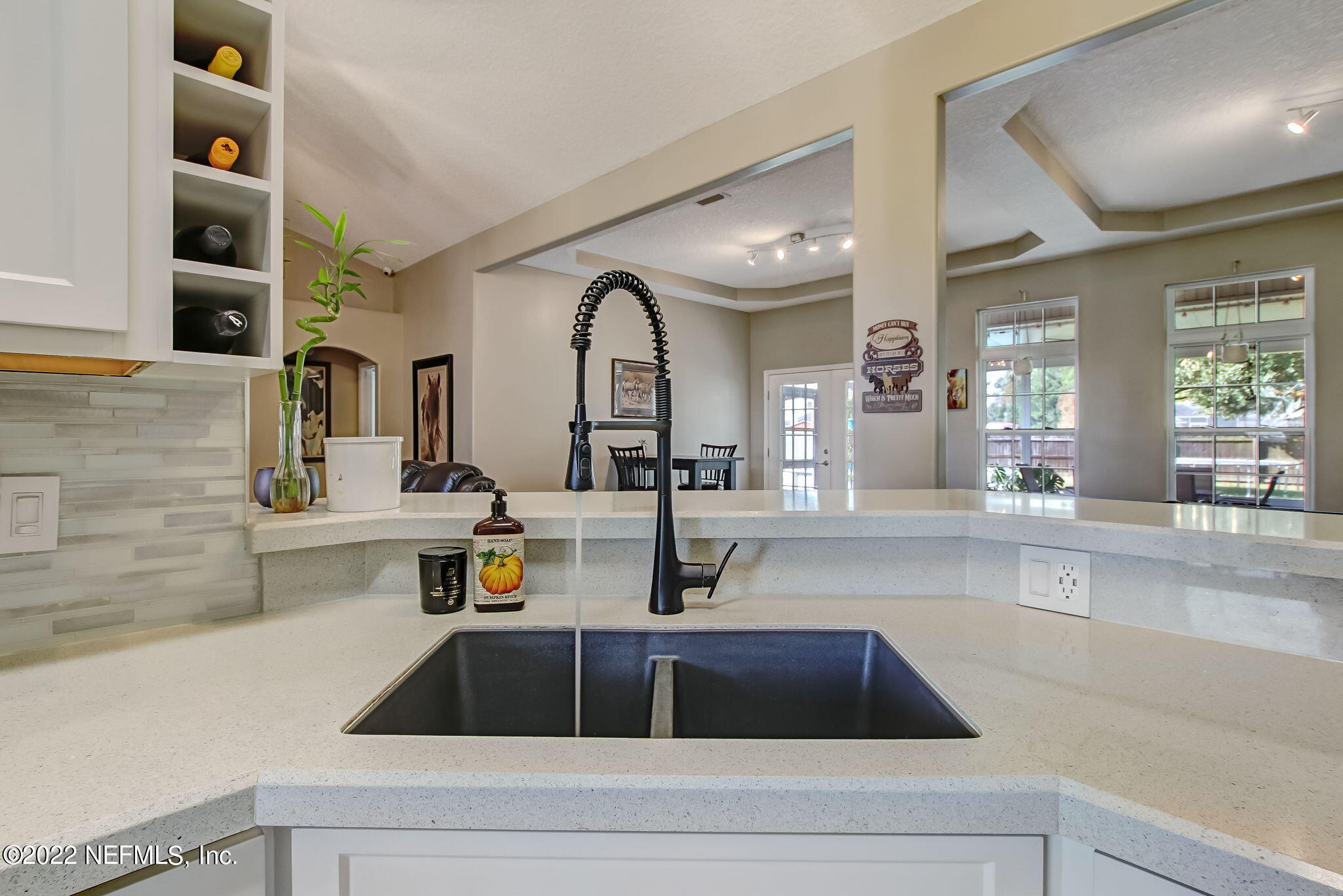 54025 Paddock Court Callahan, FL 32011 - Photo 18 of 47 a kitchen with a sink and a refrigerator