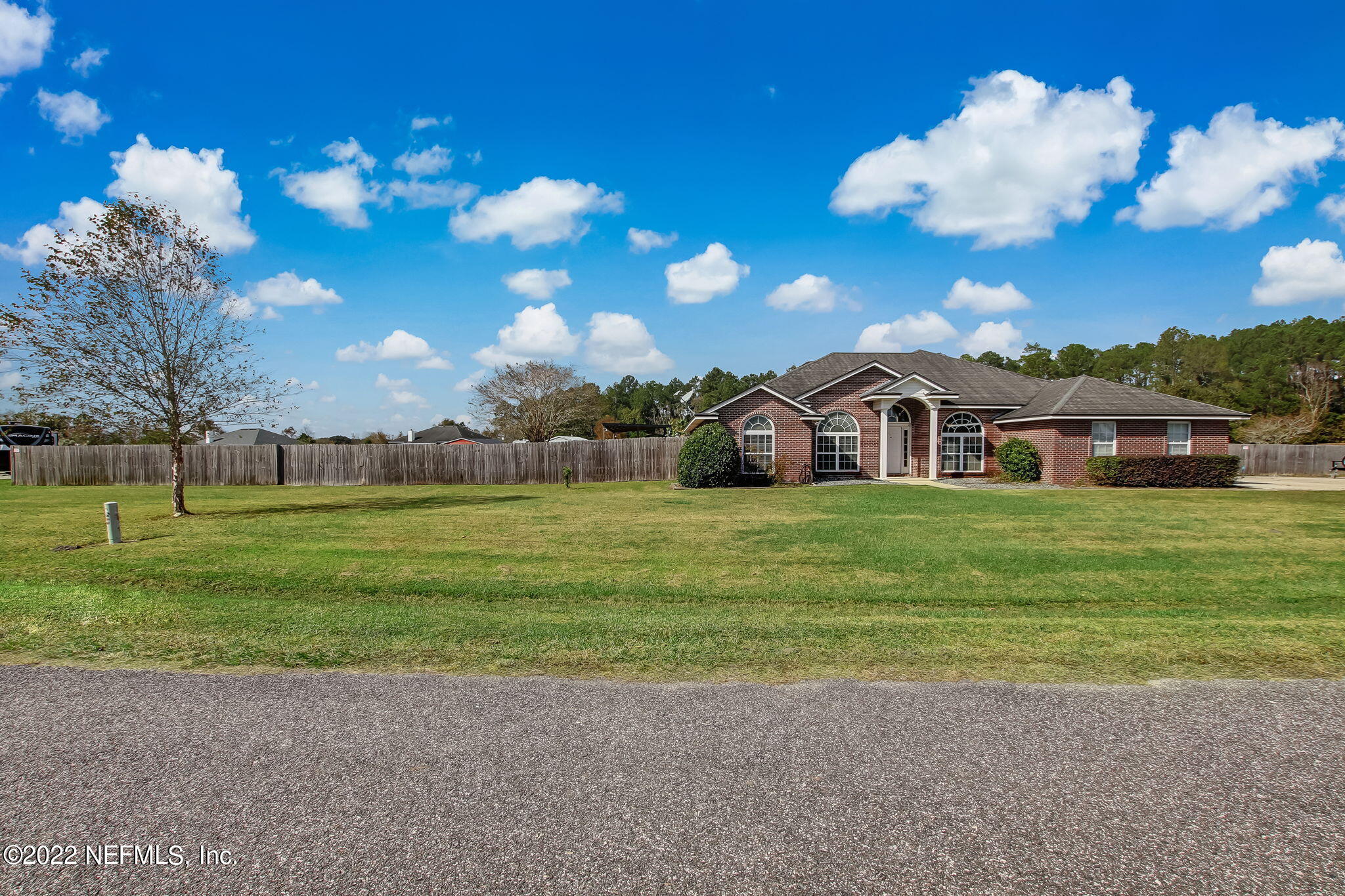 54025 Paddock Court Callahan, FL 32011 - Photo 2 of 47 a view of a house with a yard