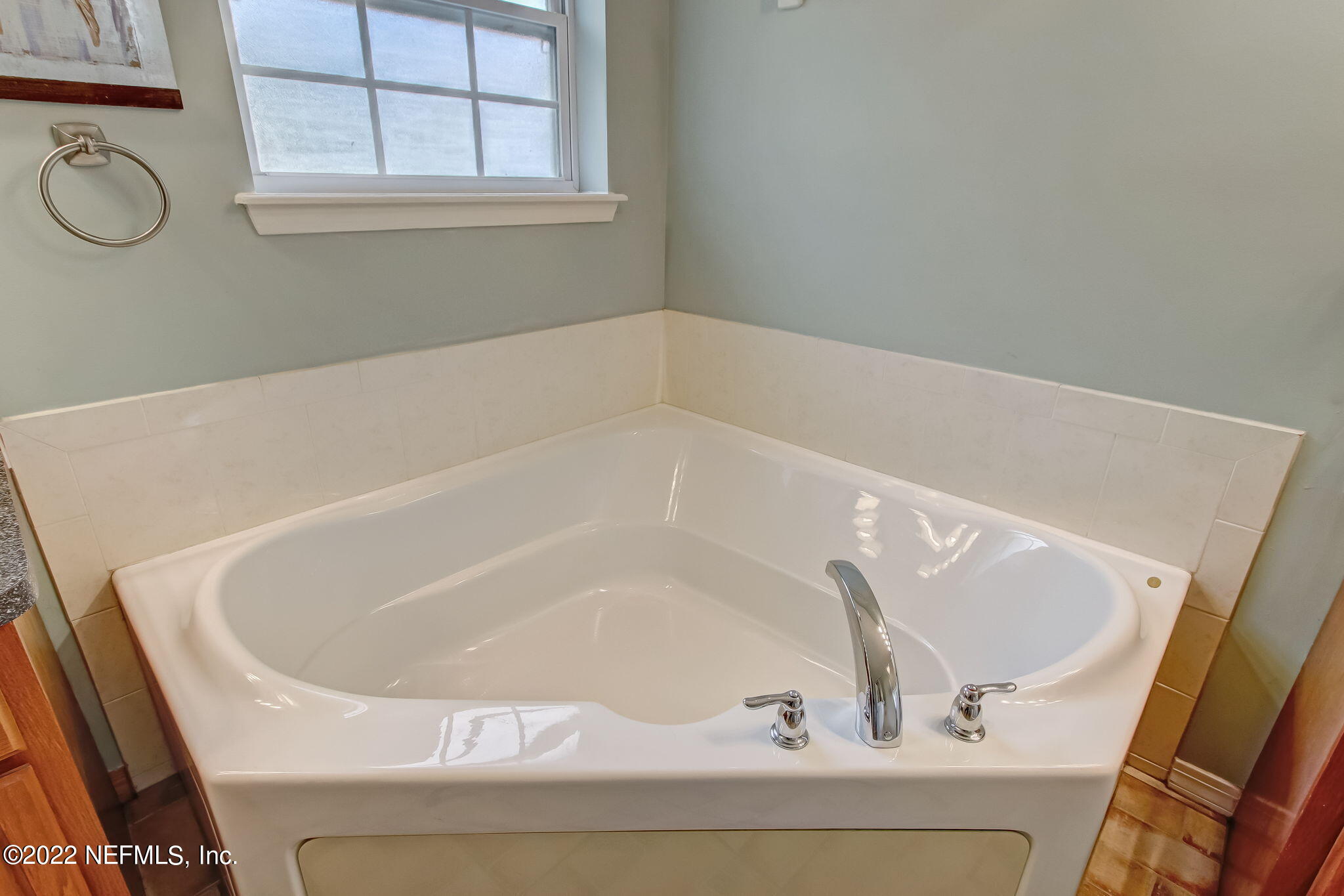 54025 Paddock Court Callahan, FL 32011 - Photo 24 of 47 a white bath tub sitting in a bathroom