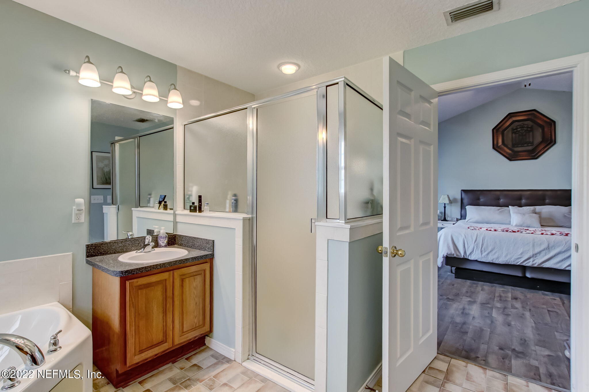 54025 Paddock Court Callahan, FL 32011 - Photo 25 of 47 a bathroom with a sink and a mirror