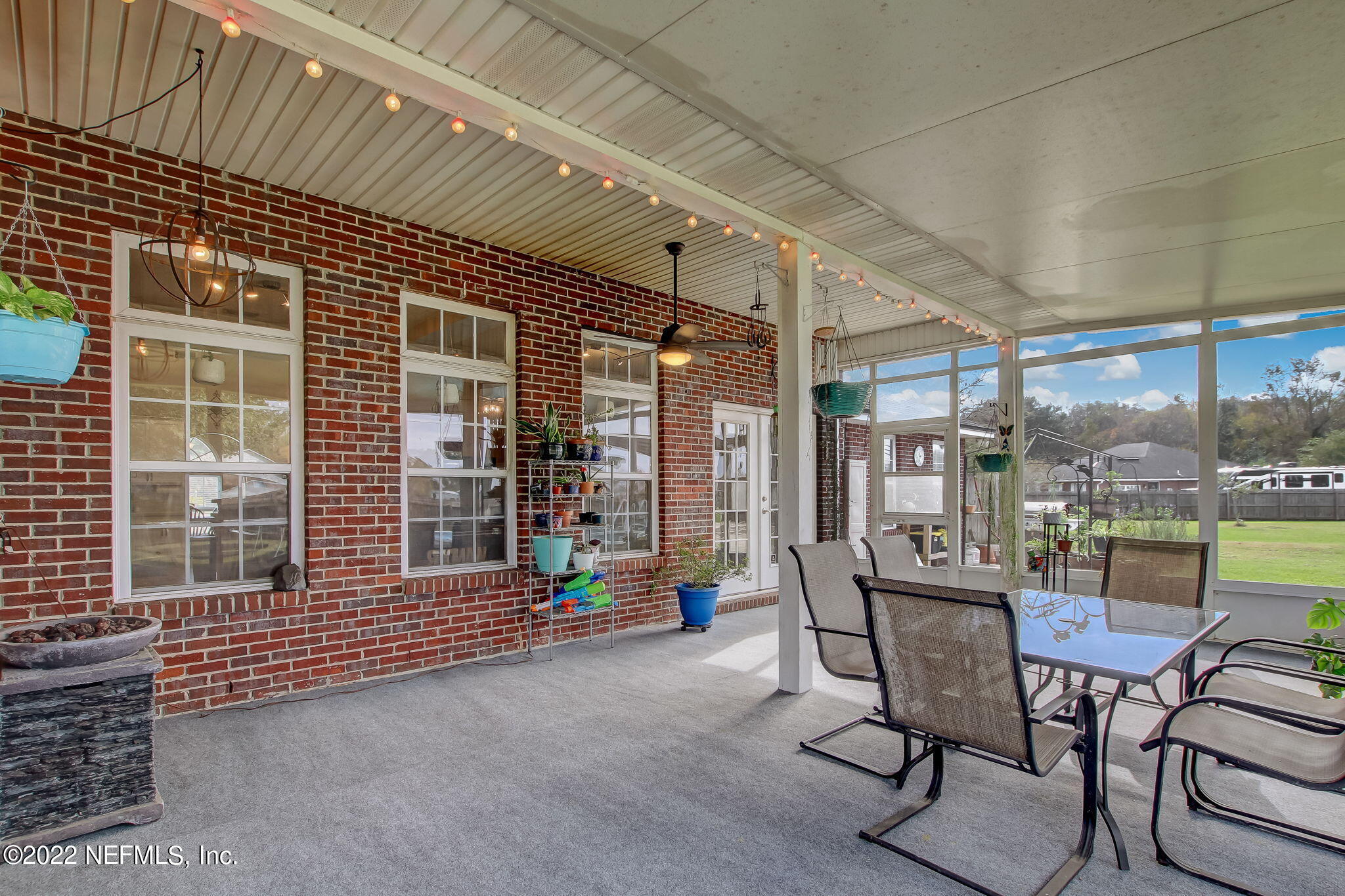54025 Paddock Court Callahan, FL 32011 - Photo 37 of 47 a view of a patio with a table and chairs