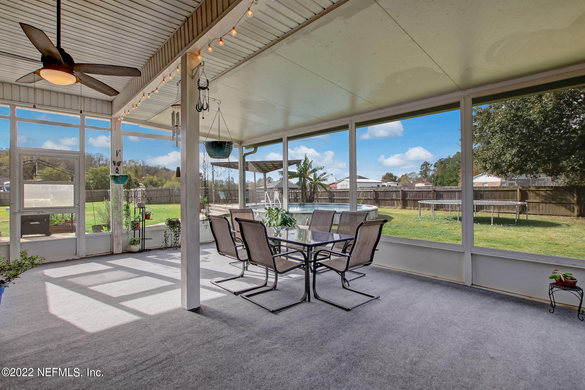 54025 Paddock Court Callahan, FL 32011 - Photo 38 of 47 a view of a patio with a table chairs and a patio