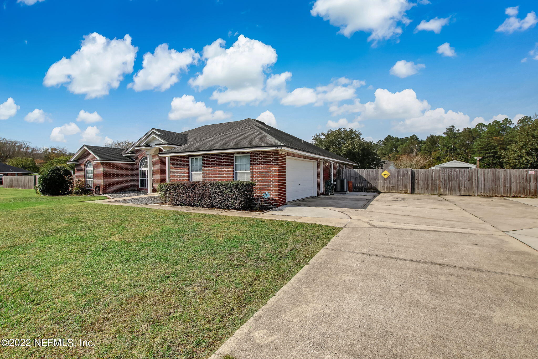 54025 Paddock Court Callahan, FL 32011 - Photo 4 of 47 a view of a house with a yard