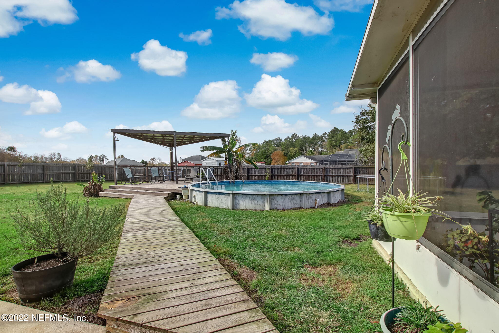54025 Paddock Court Callahan, FL 32011 - Photo 41 of 47 a view of a garden with sitting area