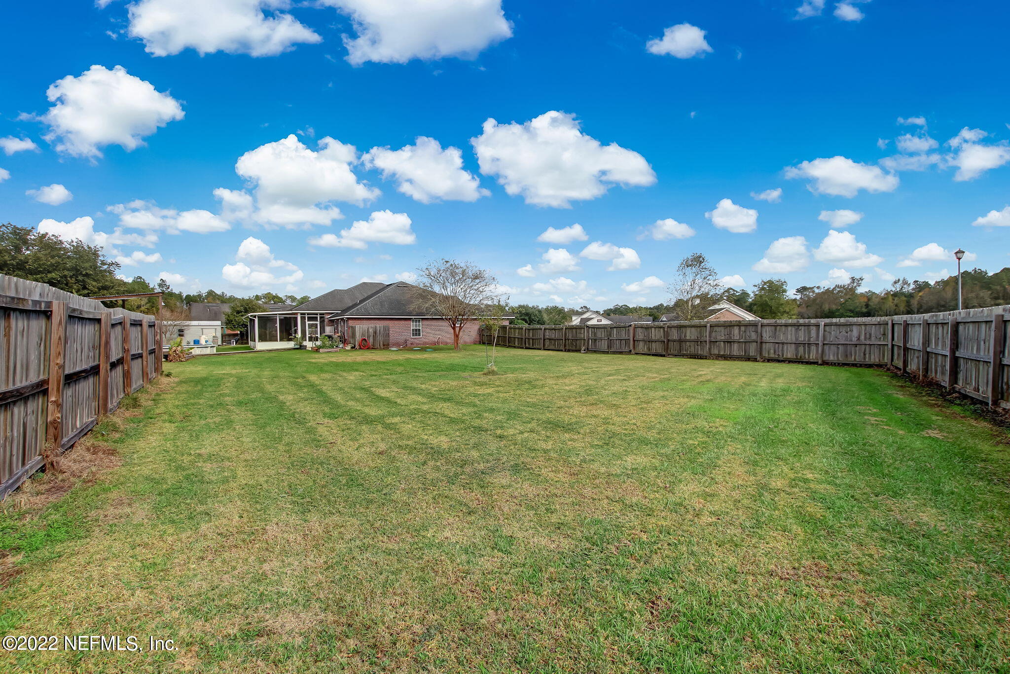 54025 Paddock Court Callahan, FL 32011 - Photo 42 of 47 a view of a golf course with a lake