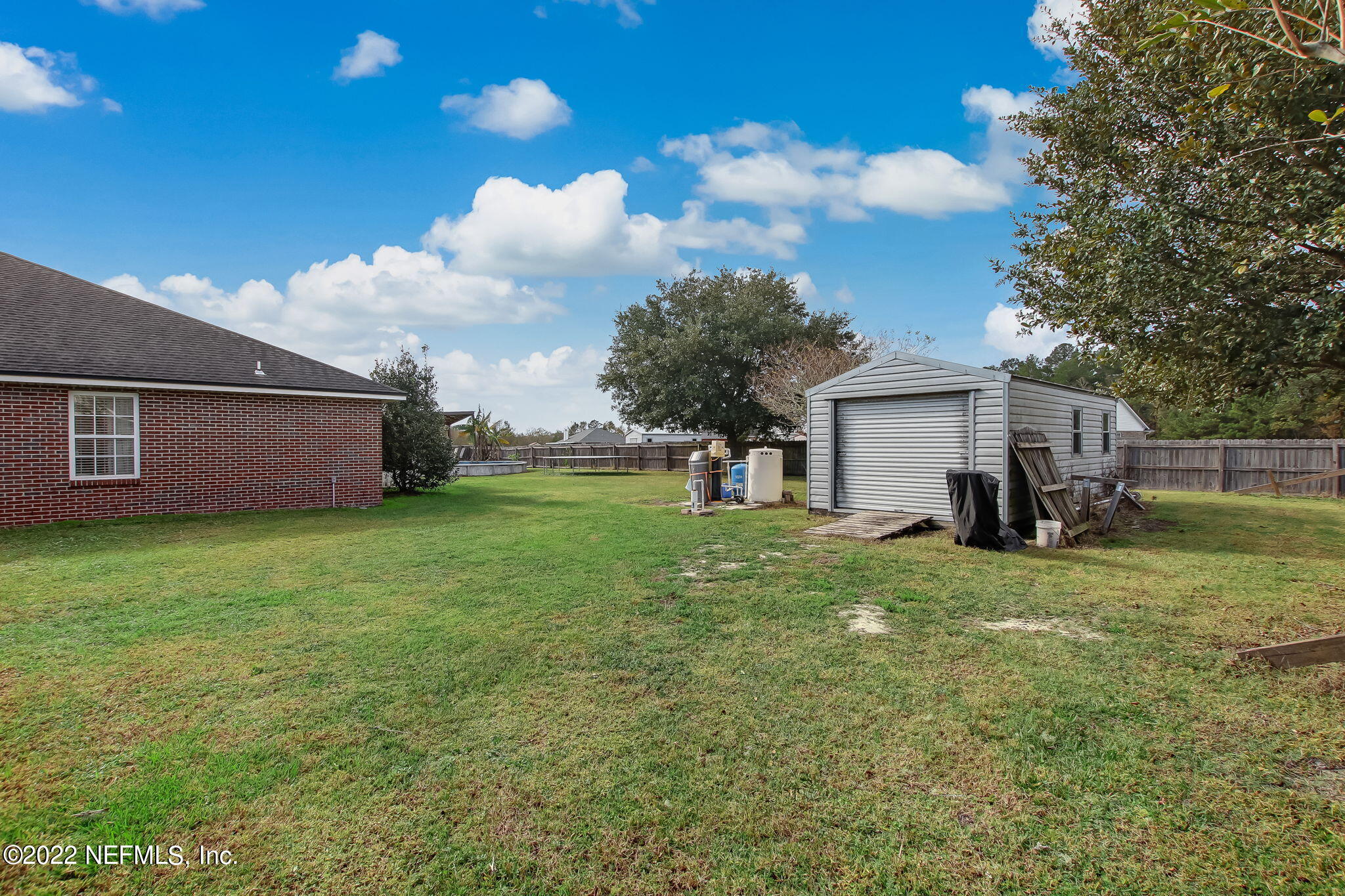54025 Paddock Court Callahan, FL 32011 - Photo 47 of 47 a view of a backyard with a garden