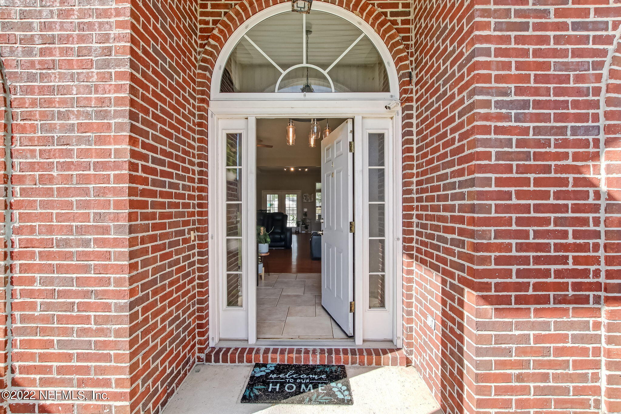 54025 Paddock Court Callahan, FL 32011 - Photo 5 of 47 a view of a brick house with entryway