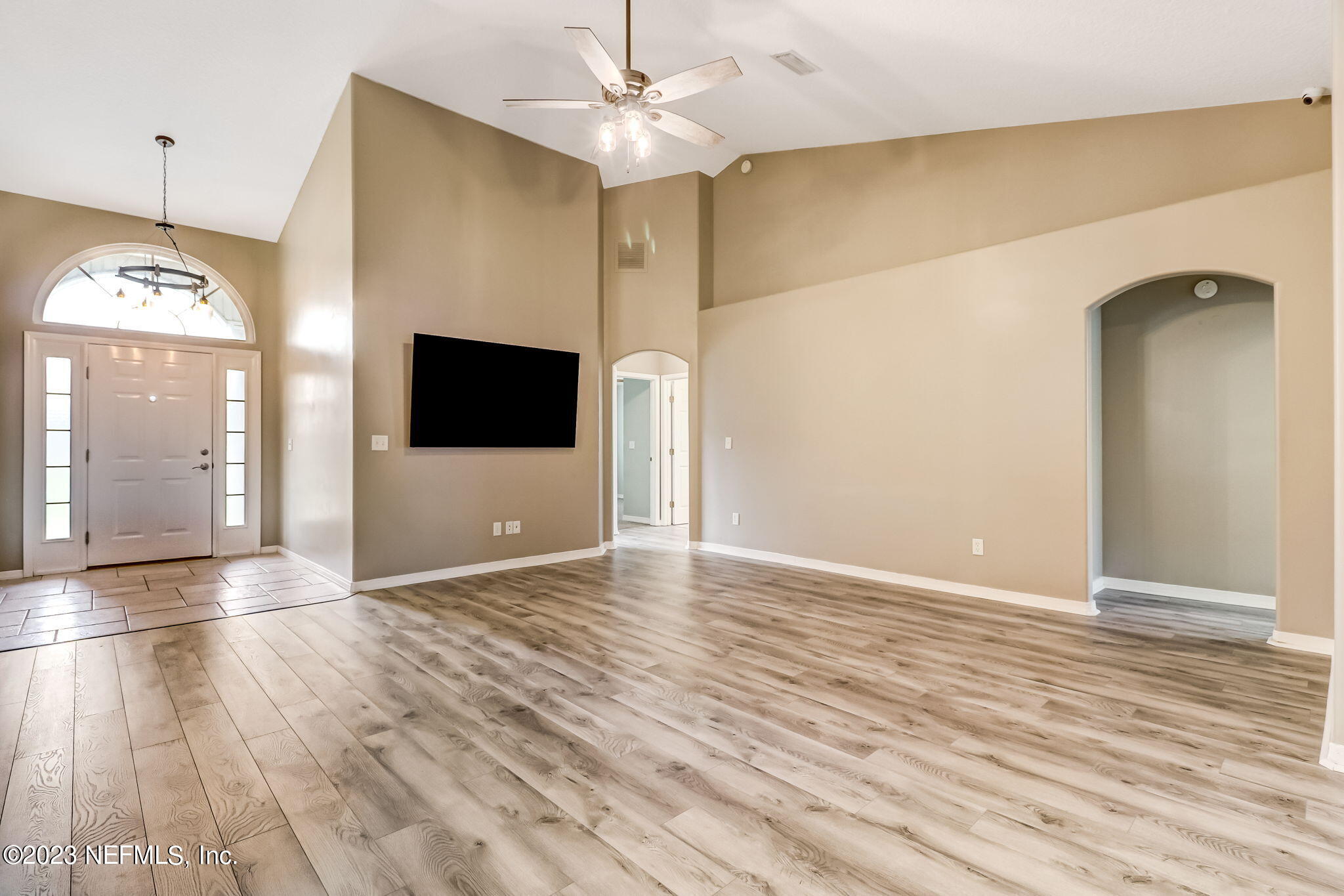 54025 Paddock Court Callahan, FL 32011 - Photo 6 of 47 a view of a room with wooden floor and door