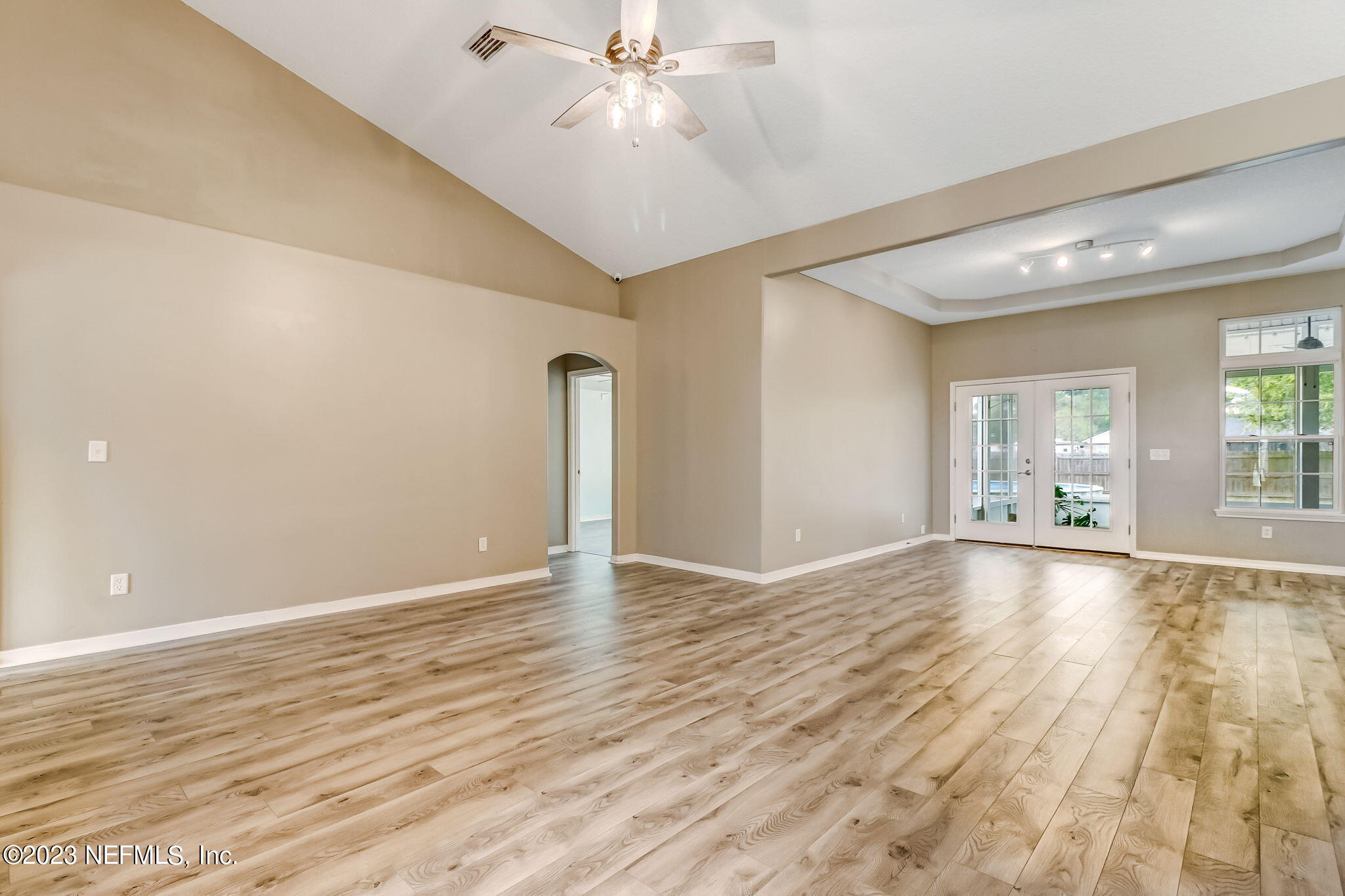 54025 Paddock Court Callahan, FL 32011 - Photo 8 of 47 wooden floor in an empty room with a window