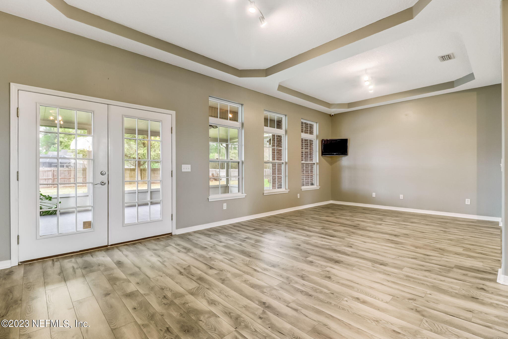 54025 Paddock Court Callahan, FL 32011 - Photo 10 of 47 a view of an empty room with a window and wooden floor