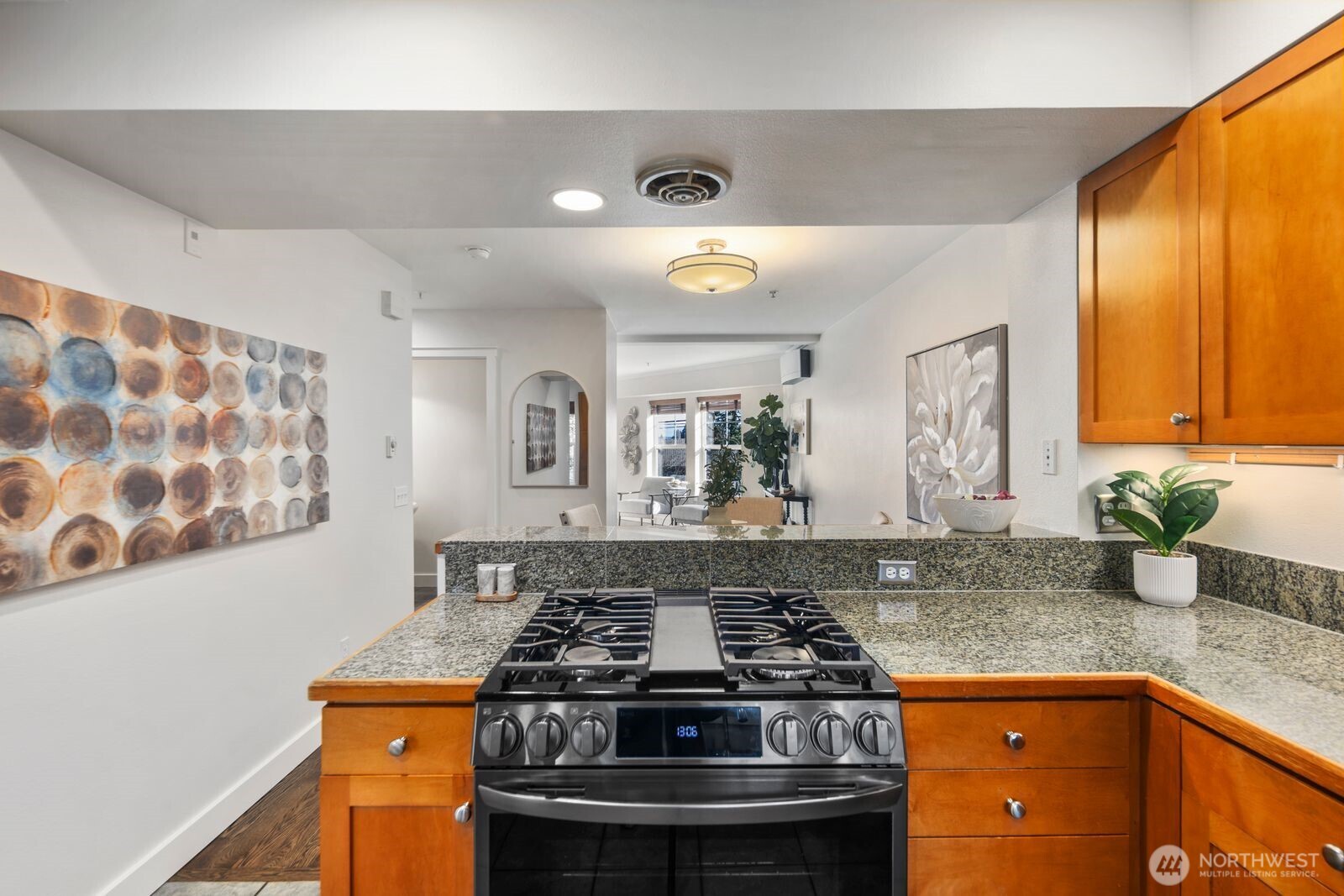 202 24th Avenue East, Unit 6 Seattle, WA 98112 - Photo 13 of 28 a kitchen with stainless steel appliances granite countertop a stove and a sink