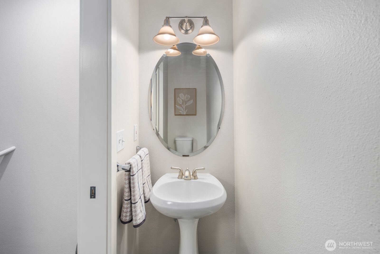 202 24th Avenue East, Unit 6 Seattle, WA 98112 - Photo 21 of 28 a bathroom with a sink and a mirror
