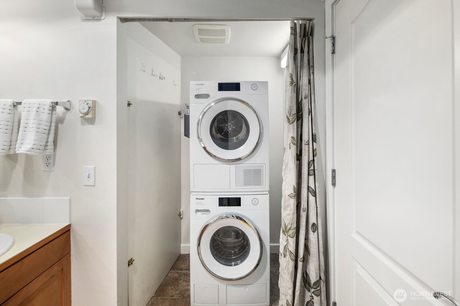 202 24th Avenue East, Unit 6 Seattle, WA 98112 - Photo 22 of 28 a utility room with dryer and washer