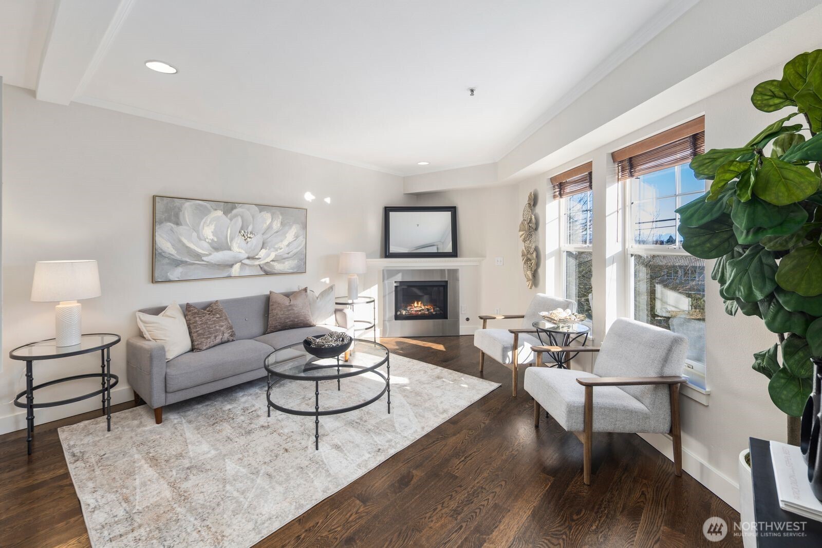 202 24th Avenue East, Unit 6 Seattle, WA 98112 - Photo 5 of 28 a living room with furniture fireplace and a large window
