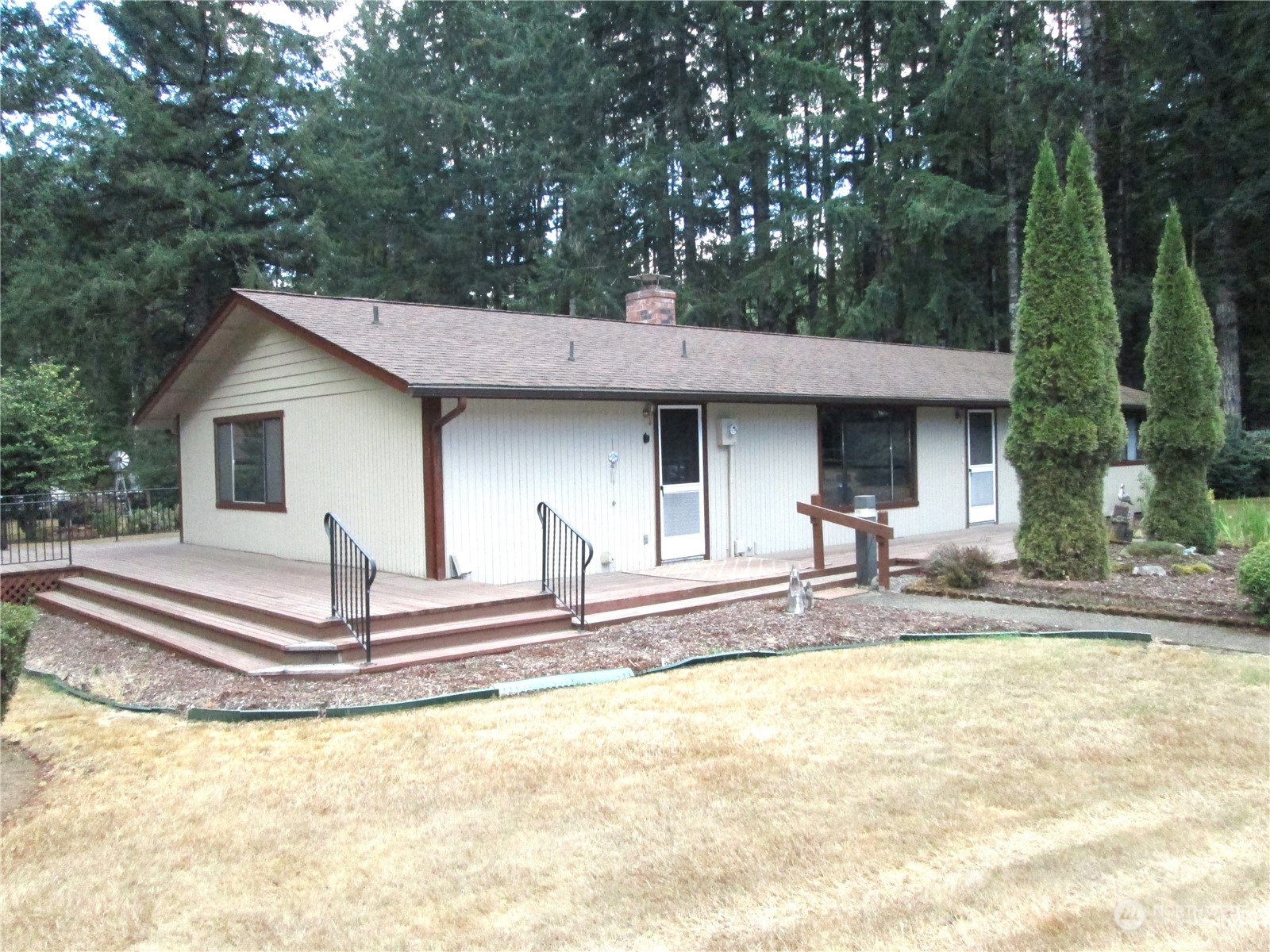 15 Webb Road Southwest Lakebay, WA 98349 - Photo 1 of 39 a view of a house with backyard and trees