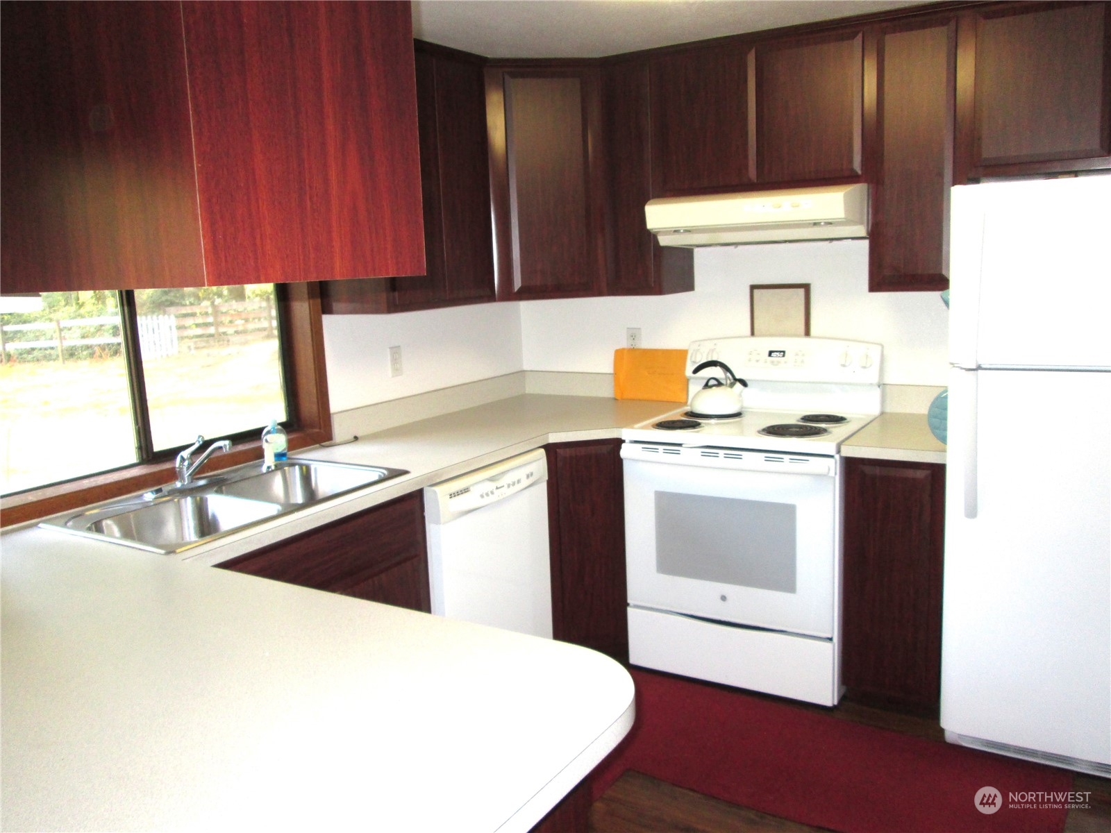 15 Webb Road Southwest Lakebay, WA 98349 - Photo 11 of 39 a kitchen with a sink stove and cabinets