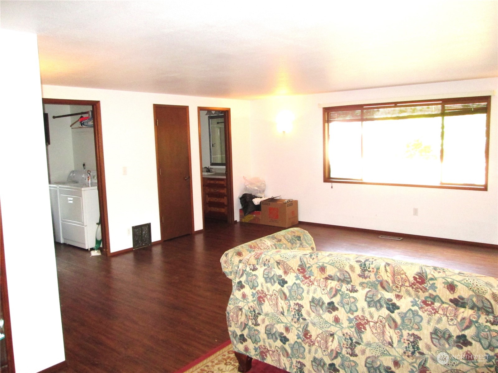 15 Webb Road Southwest Lakebay, WA 98349 - Photo 12 of 39 a view of a bedroom with wooden floor and windows