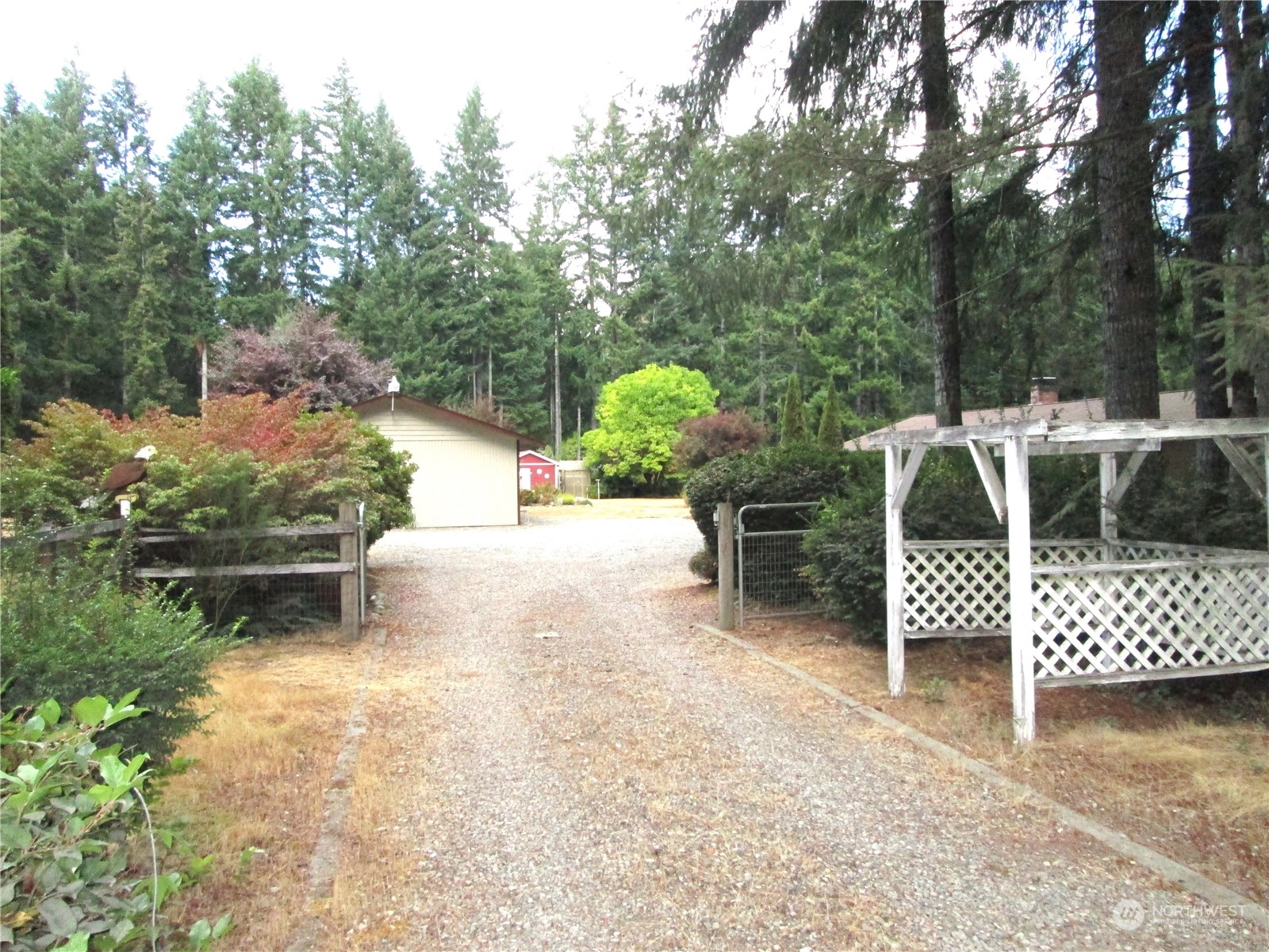 15 Webb Road Southwest Lakebay, WA 98349 - Photo 2 of 39 a view of a chairs and table in the patio next to a yard