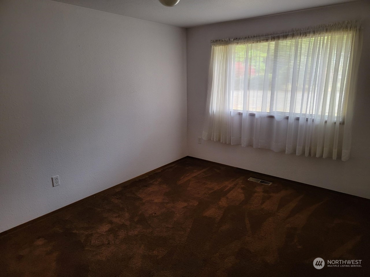 15 Webb Road Southwest Lakebay, WA 98349 - Photo 22 of 39 an empty room with a window