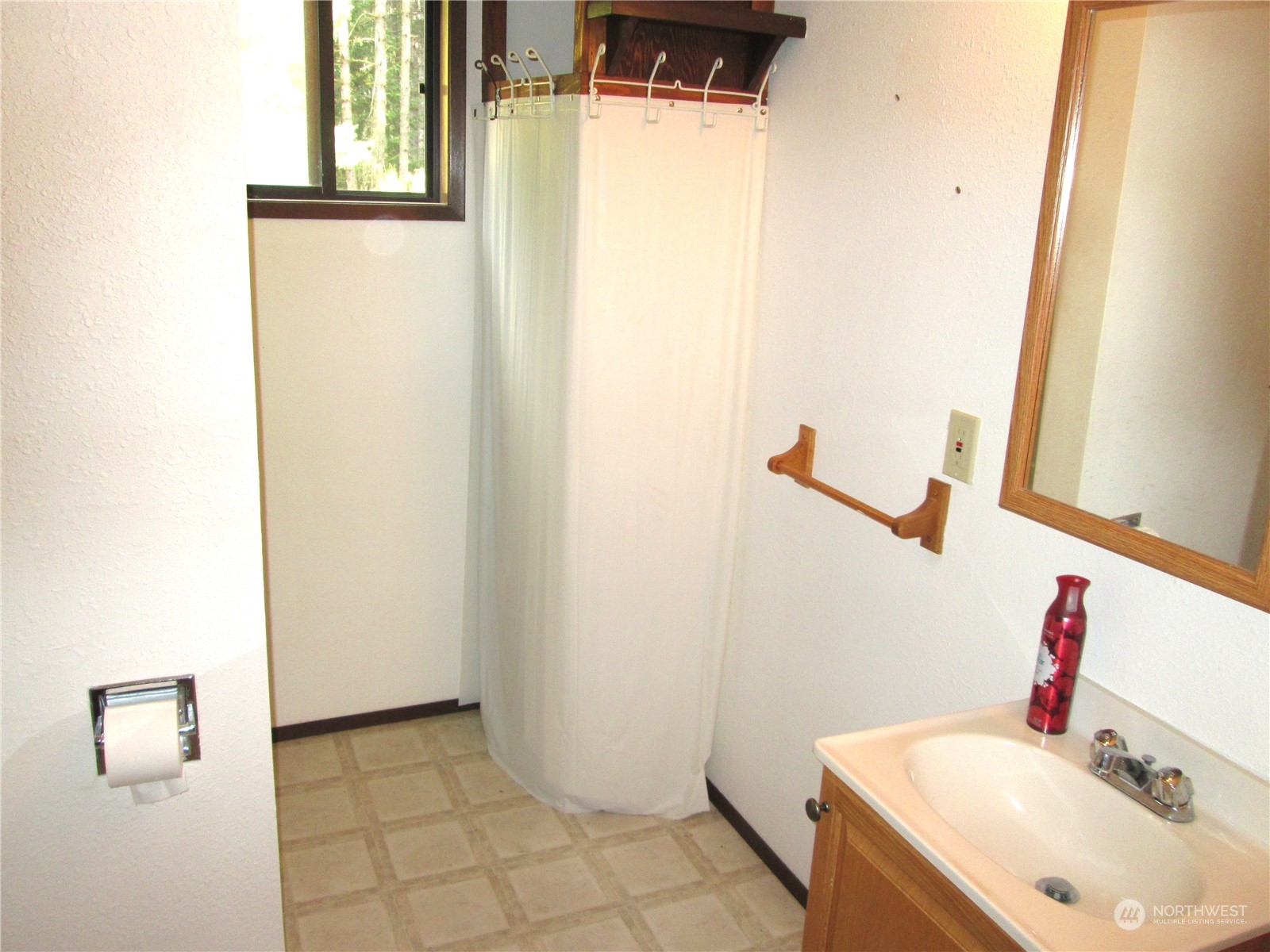 15 Webb Road Southwest Lakebay, WA 98349 - Photo 29 of 39 a bathroom with a sink and a mirror